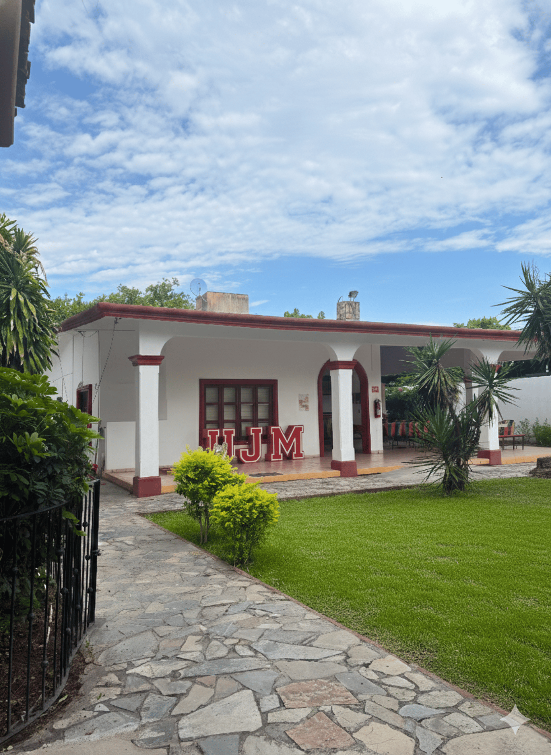 an abstract photo of a curved building with a blue sky in the background