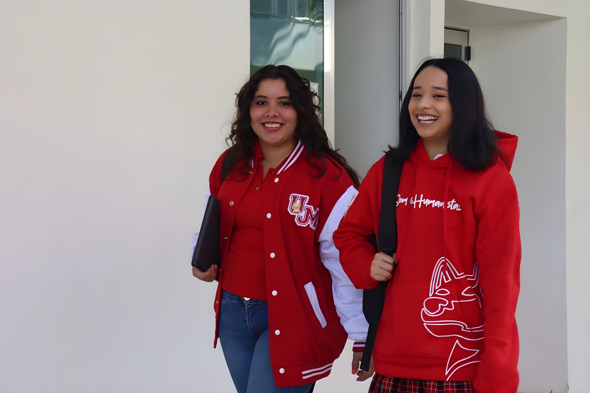 an abstract photo of a curved building with a blue sky in the background