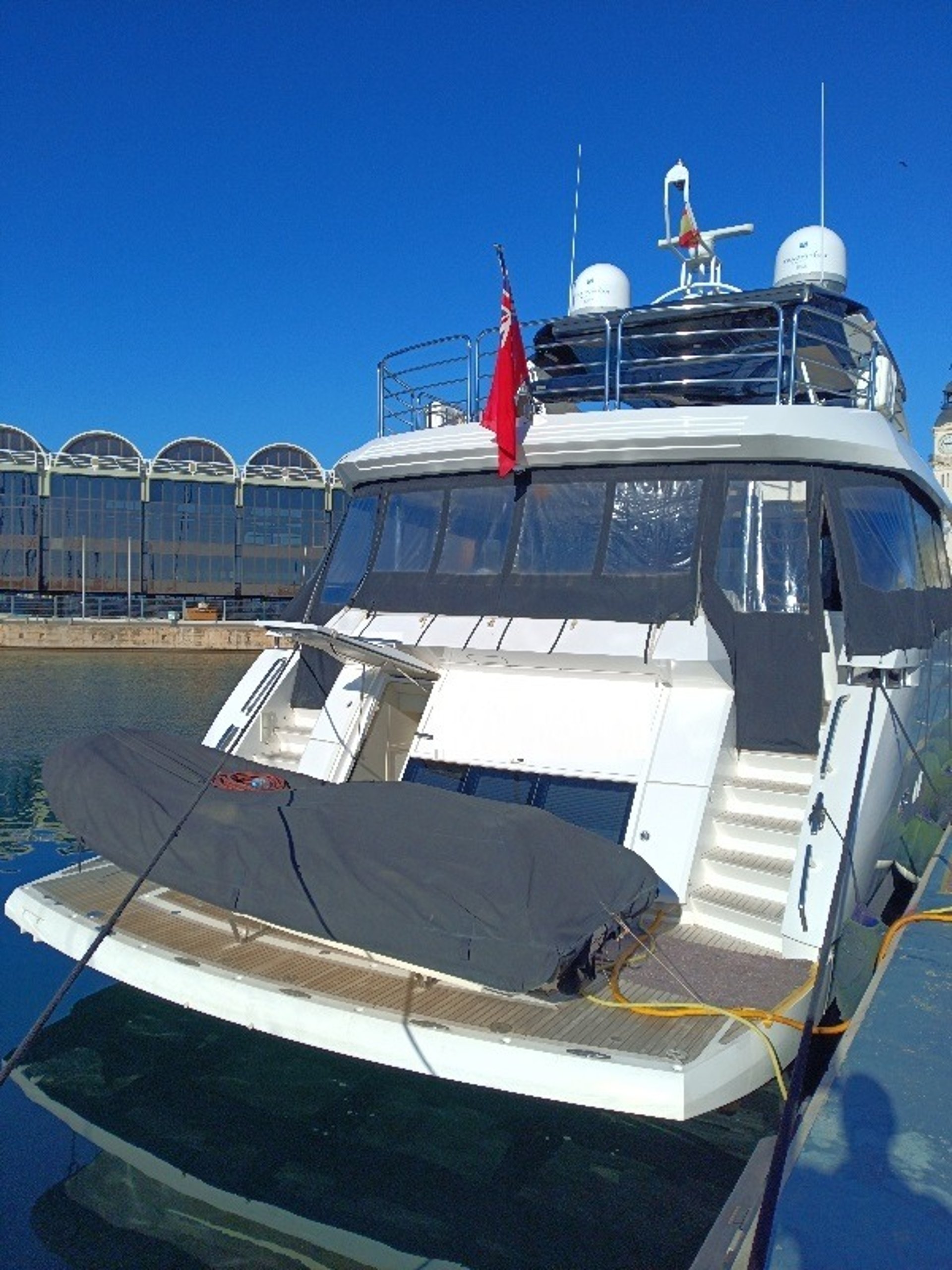 an abstract photo of a curved building with a blue sky in the background