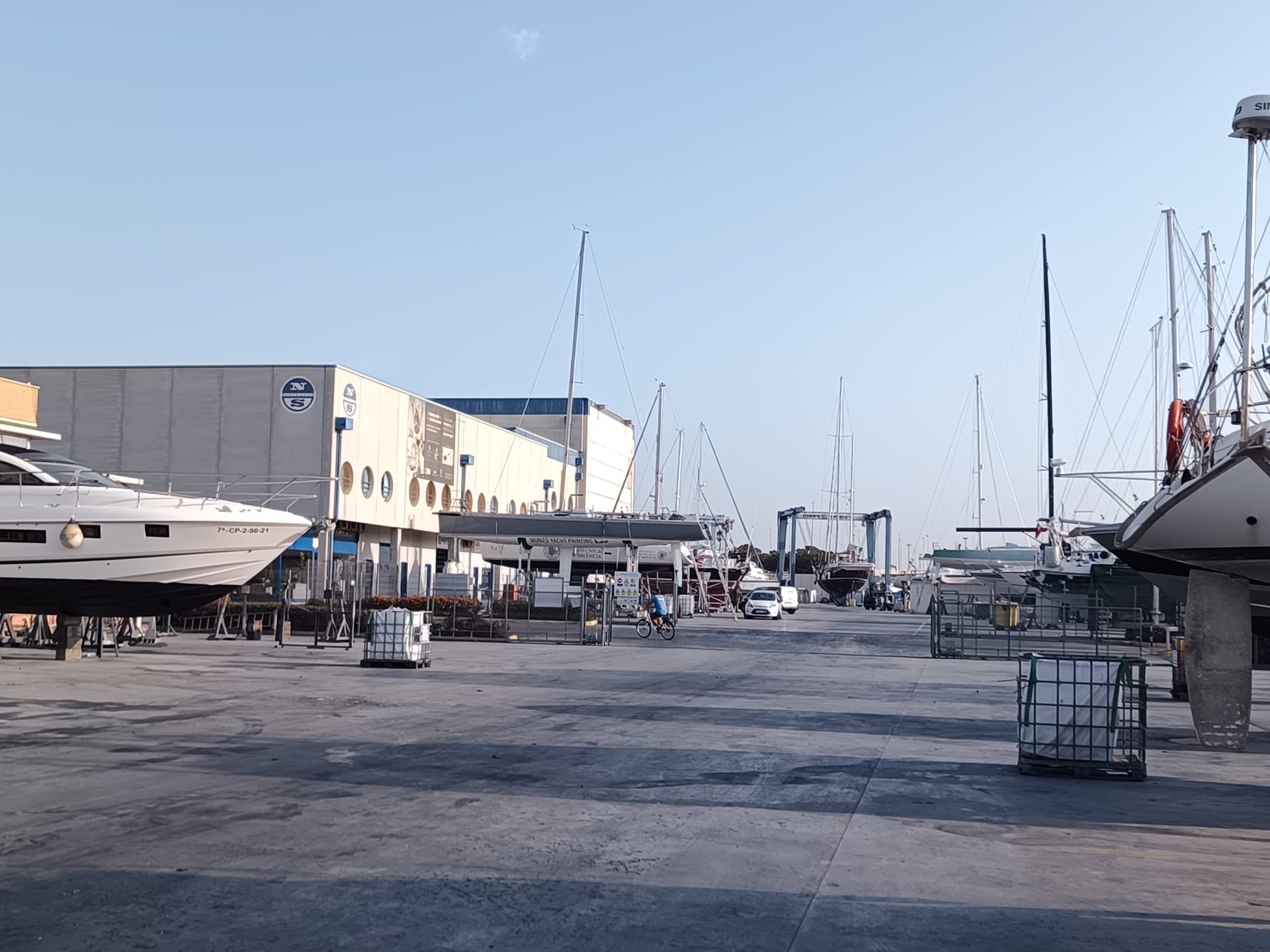 woman wearing yellow long-sleeved dress under white clouds and blue sky during daytime