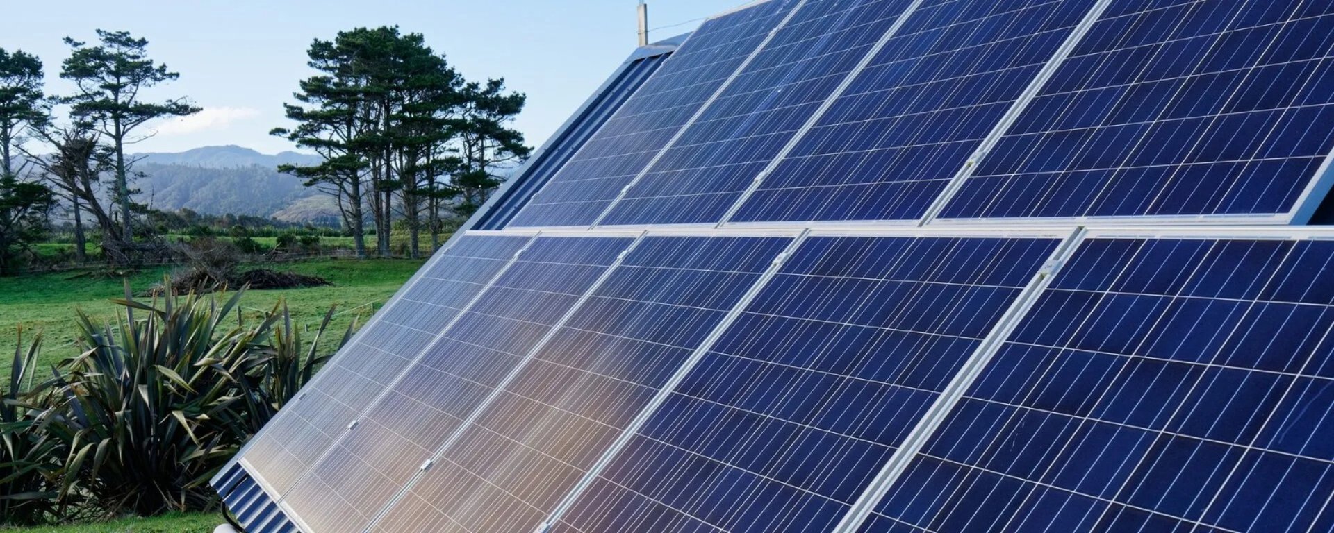 a white hard hat sitting on top of a solar panel