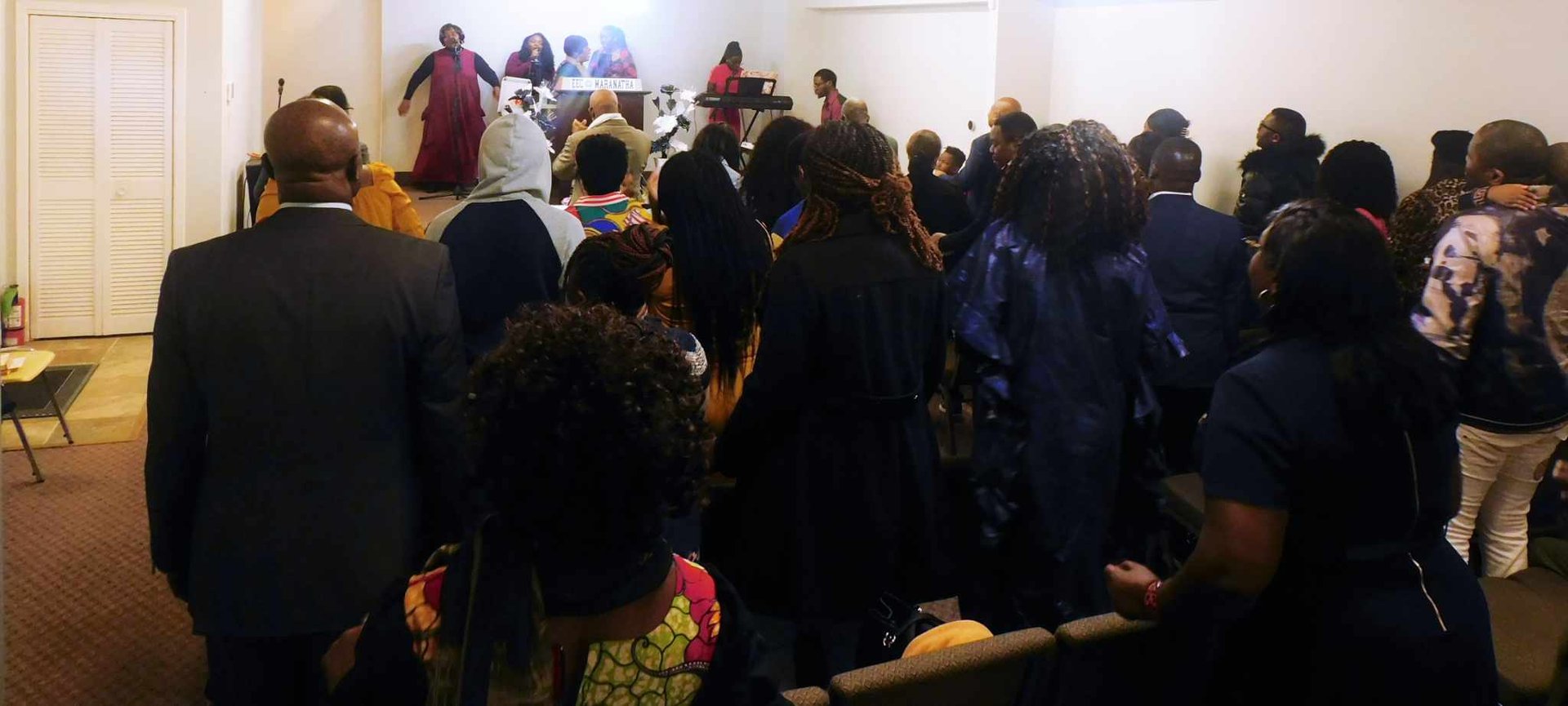 an abstract photo of a curved building with a blue sky in the background