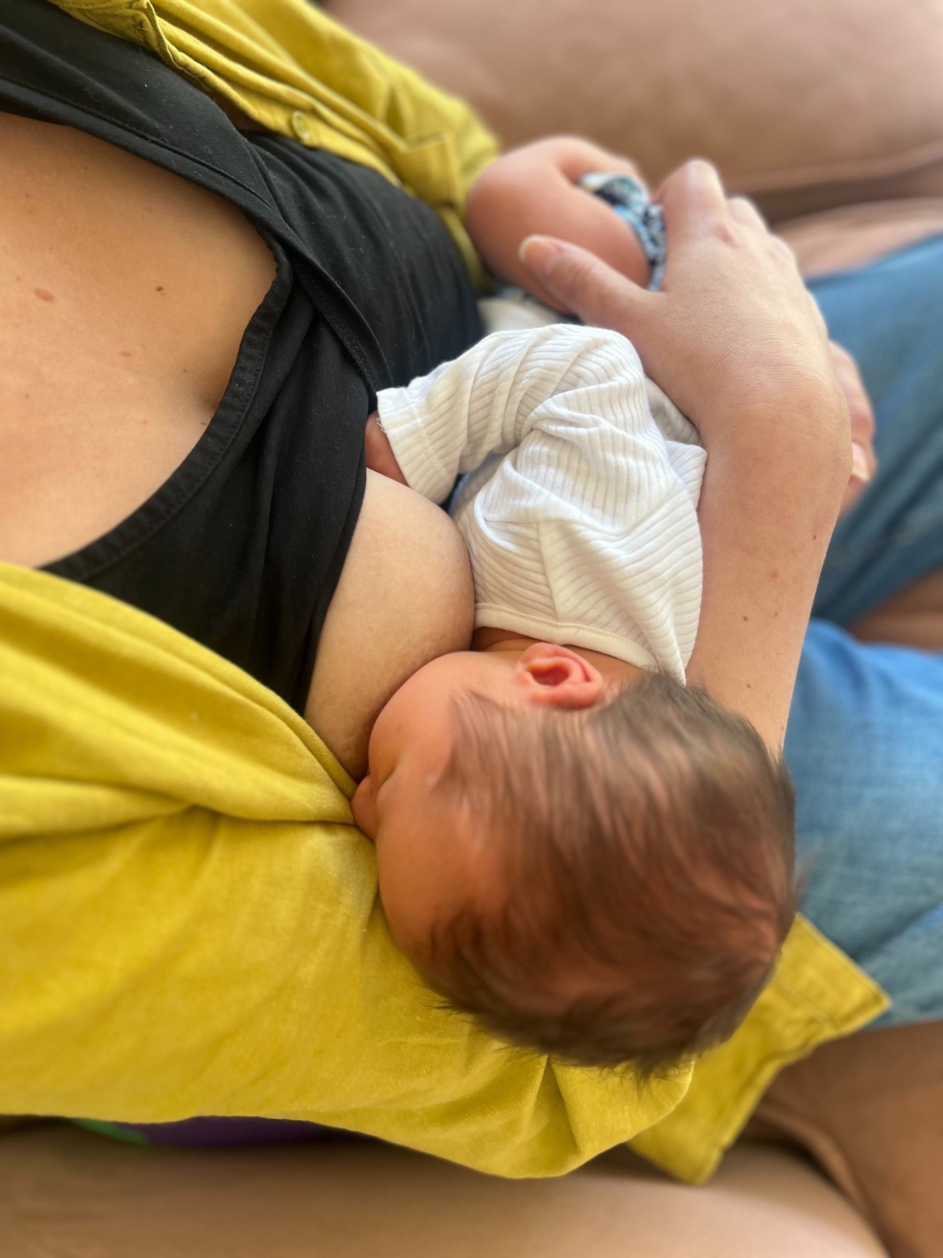 sleeping baby on white textile