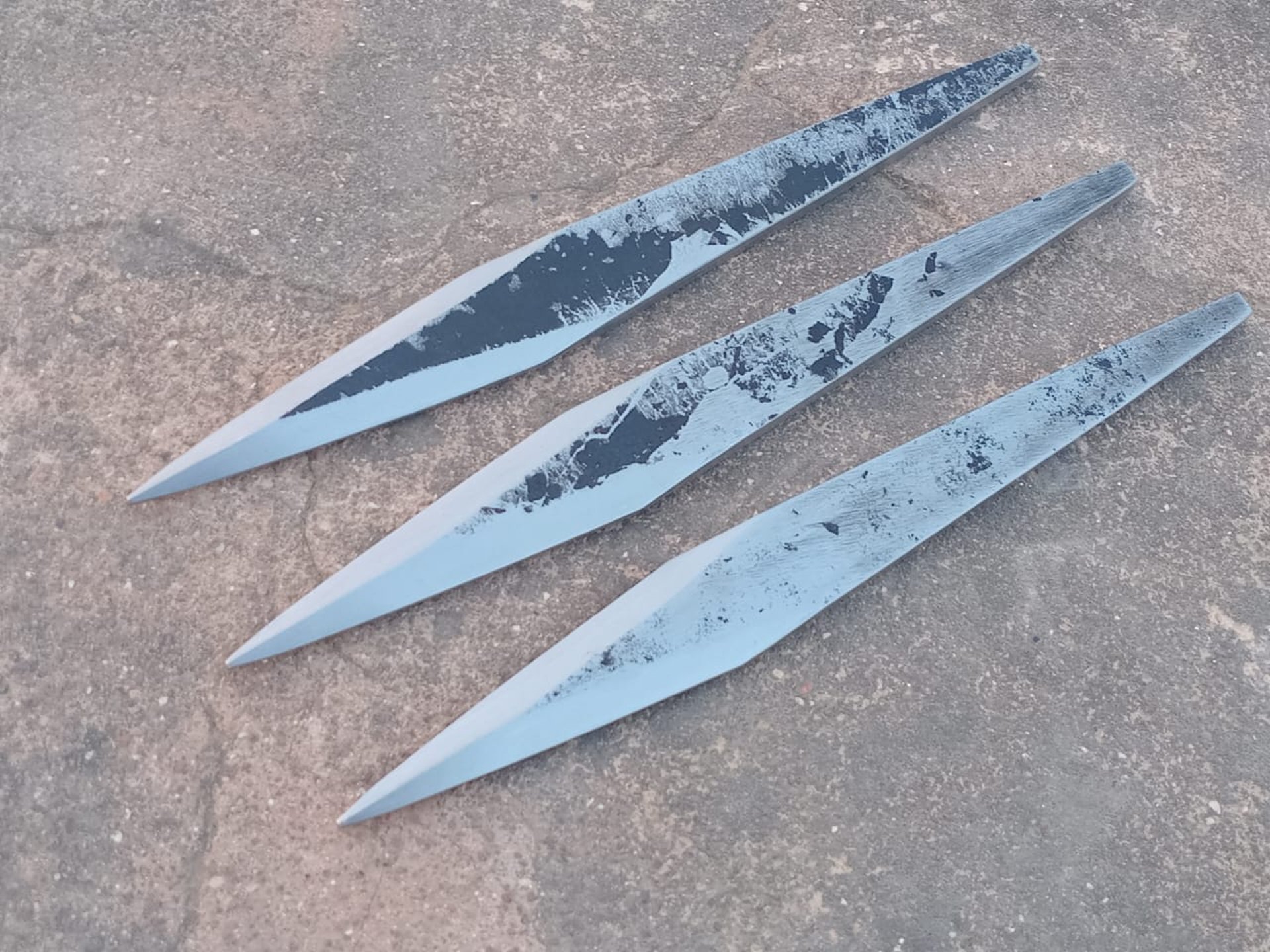 a pair of knives sitting on top of a table