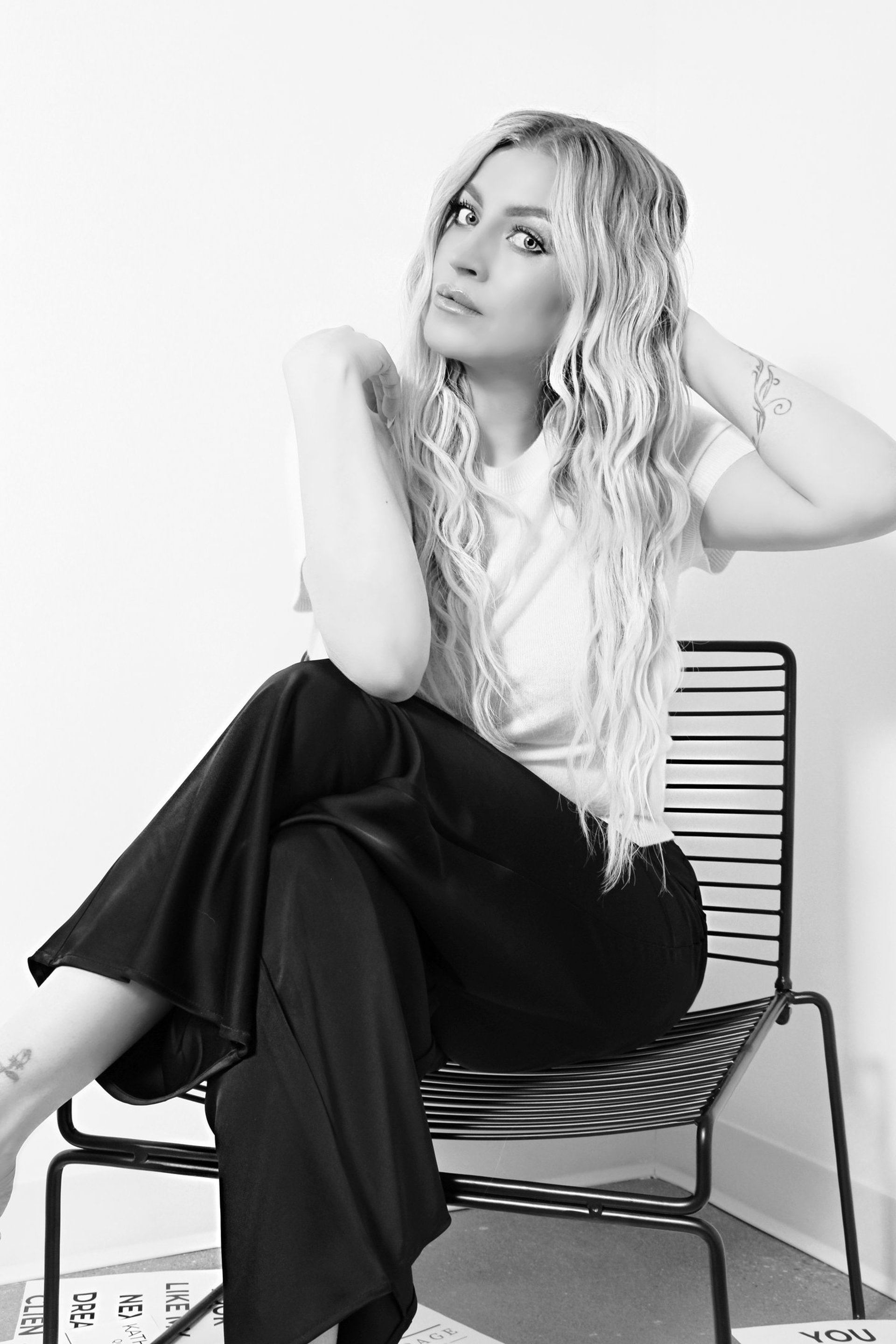 an abstract photo of a curved building with a blue sky in the background