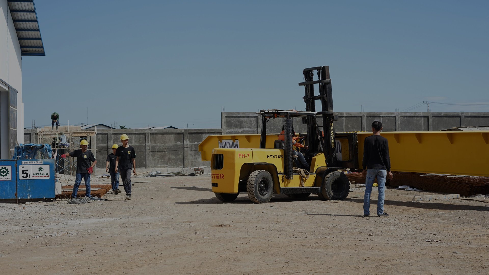 an abstract photo of a curved building with a blue sky in the background