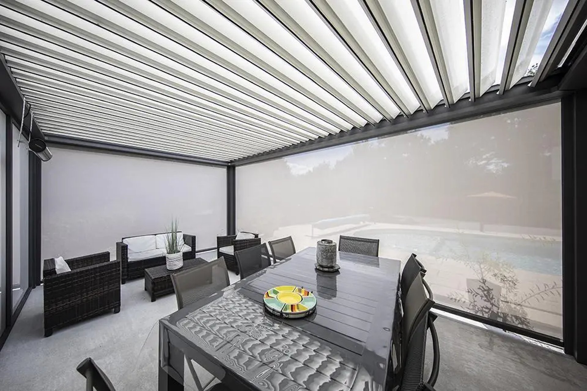 an abstract photo of a curved building with a blue sky in the background