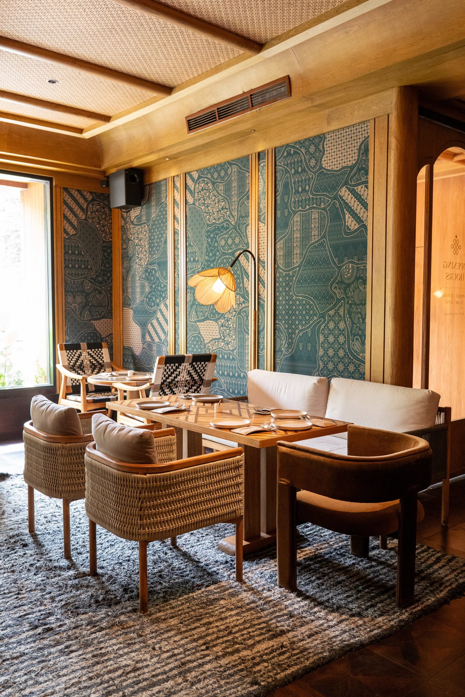 an abstract photo of a curved building with a blue sky in the background