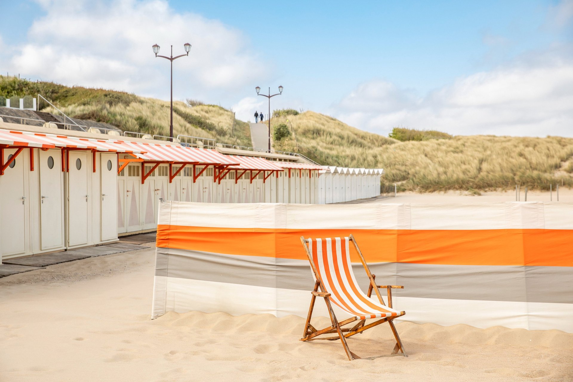 an abstract photo of a curved building with a blue sky in the background