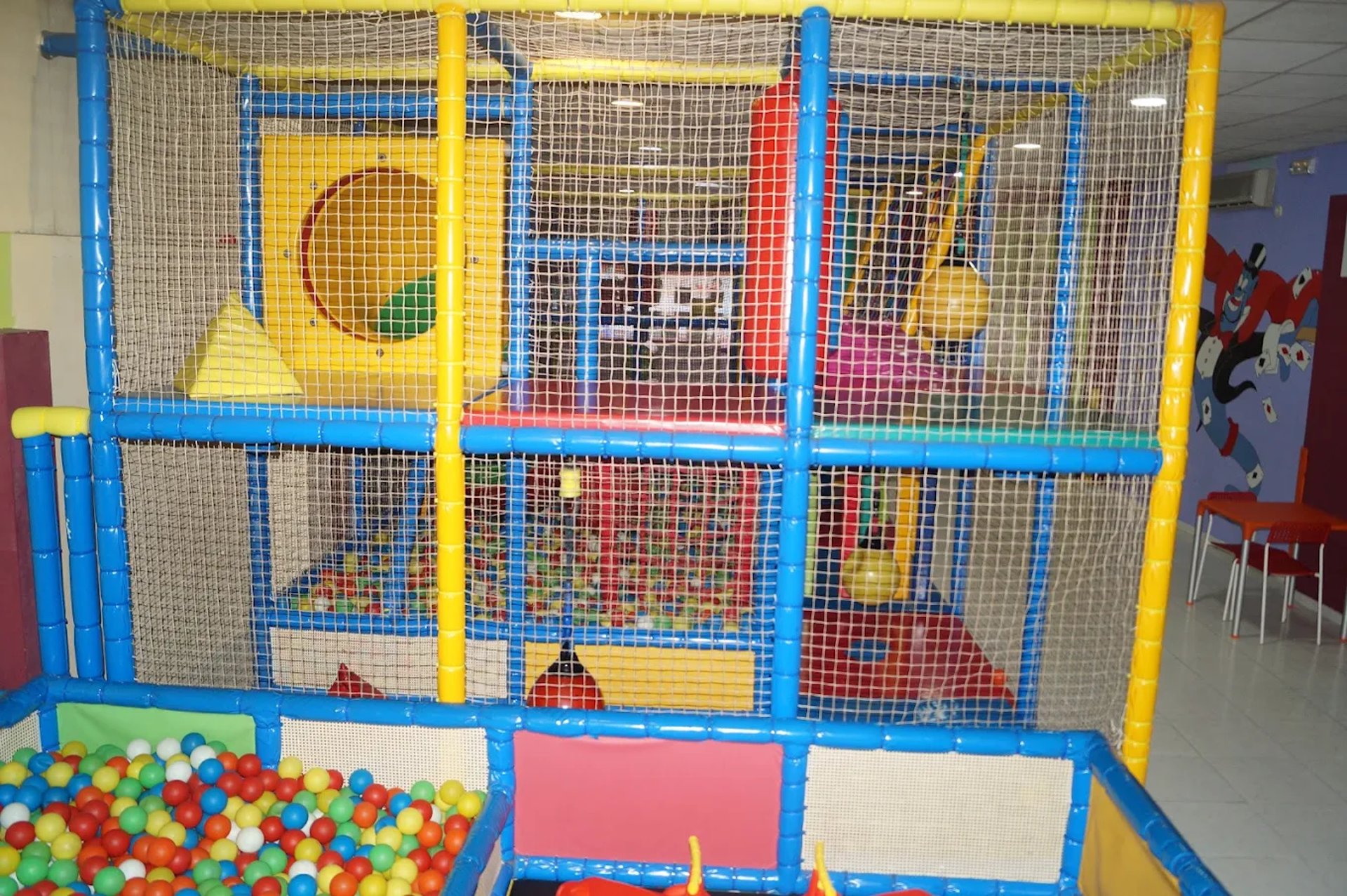 A children's play area with a slide and slides