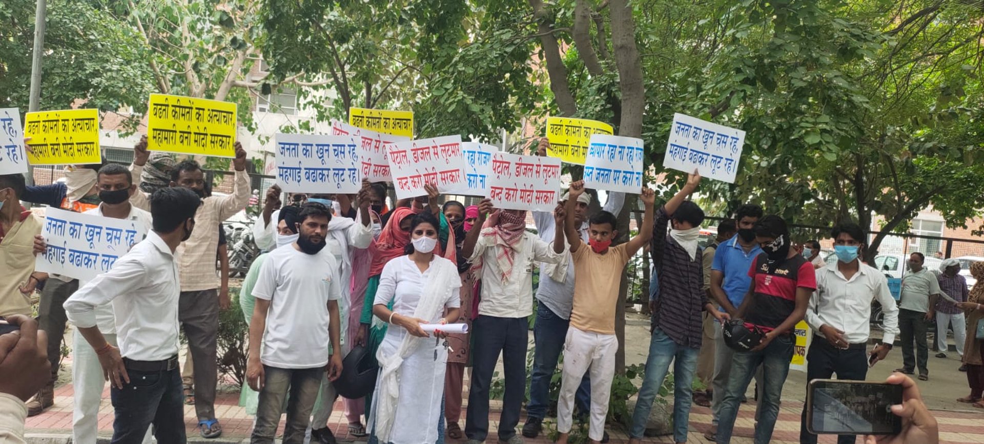 woman wearing yellow long-sleeved dress under white clouds and blue sky during daytime
