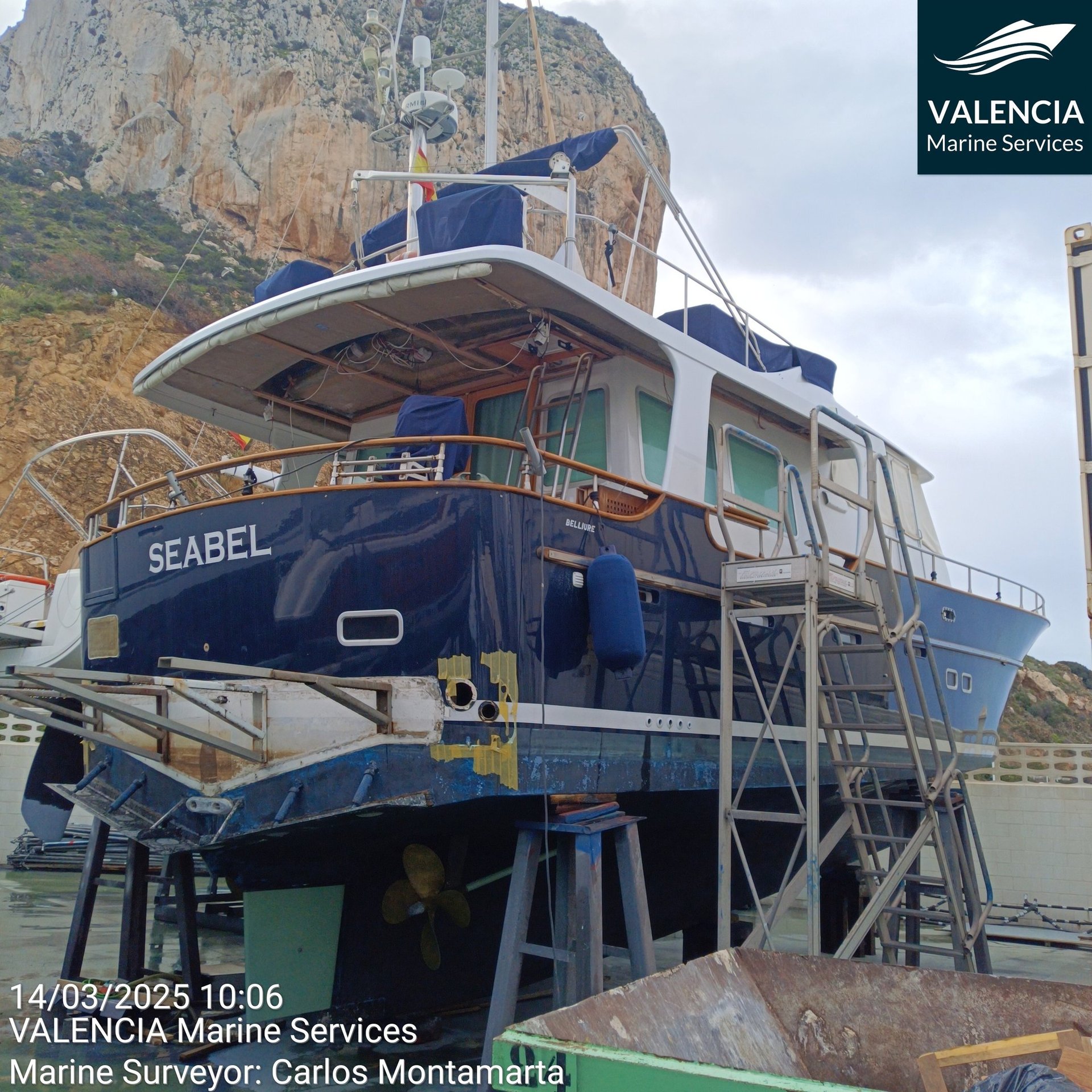 a large white boat docked at a pier