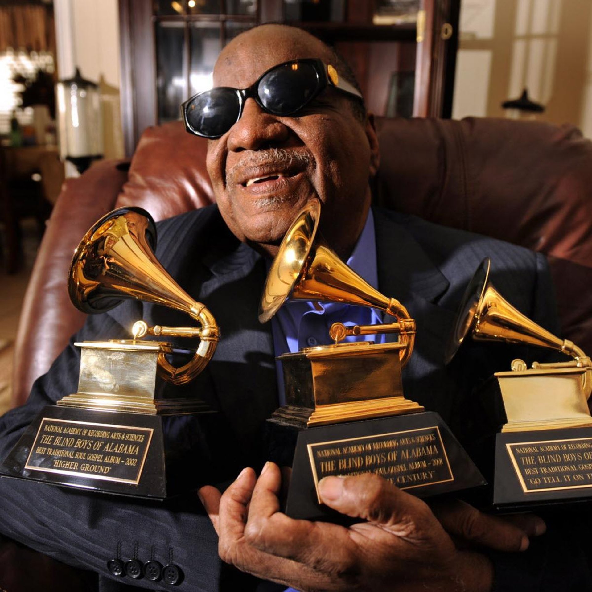 an abstract photo of a curved building with a blue sky in the background