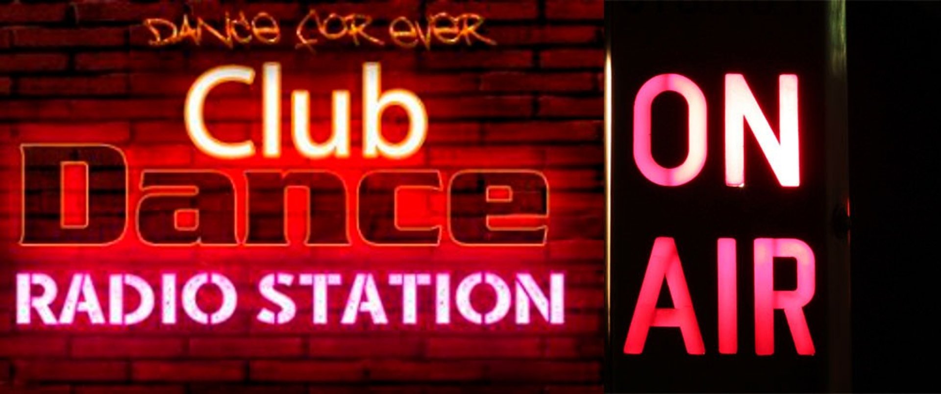 a stage with a laptop and microphone in front of a crowd