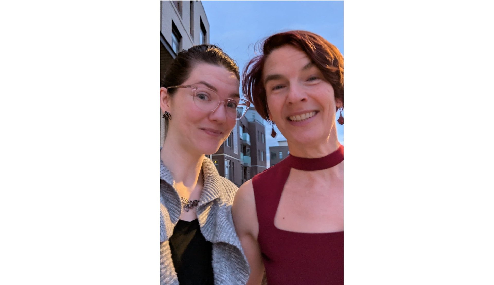 an abstract photo of a curved building with a blue sky in the background