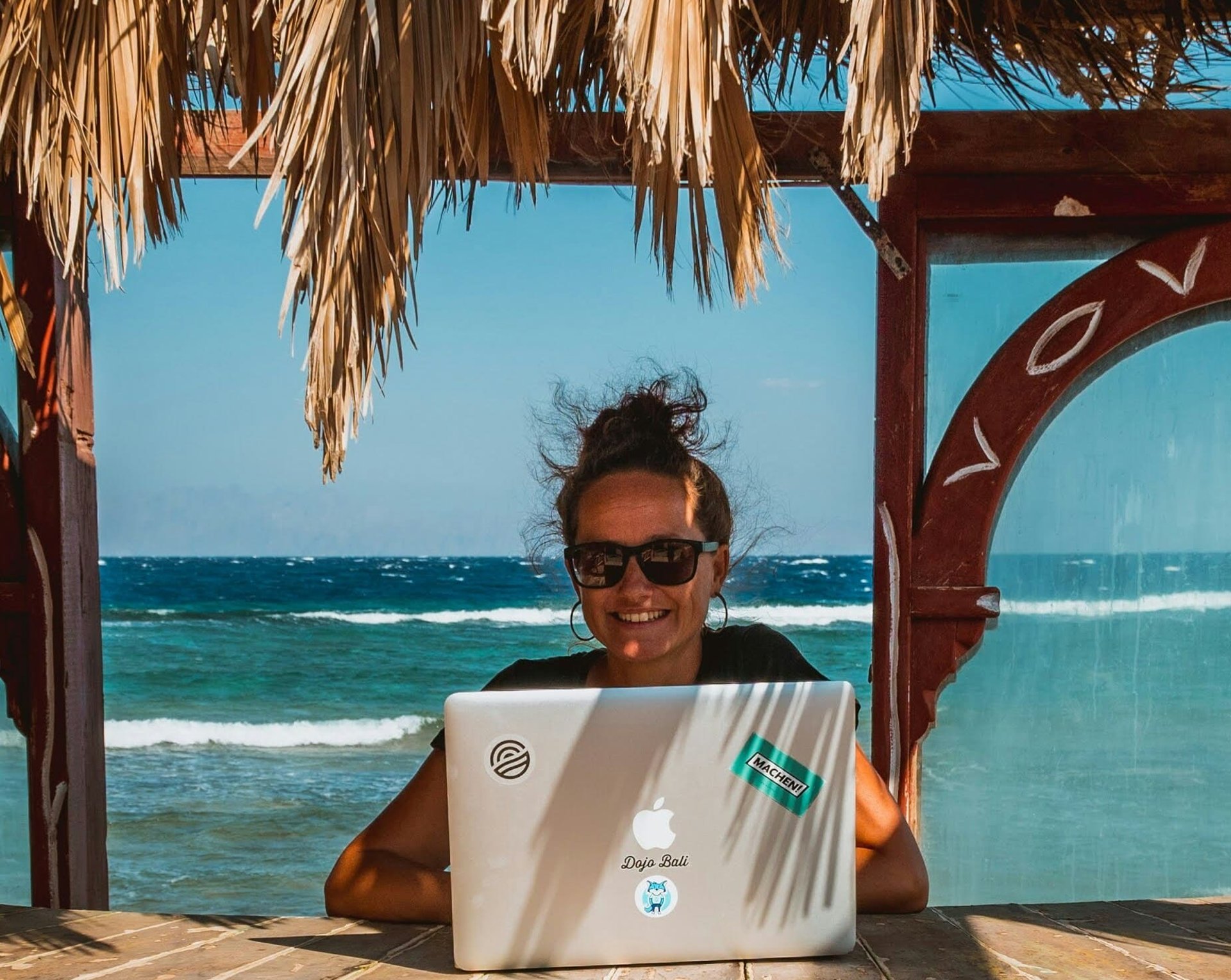 MacBook Pro near white open book