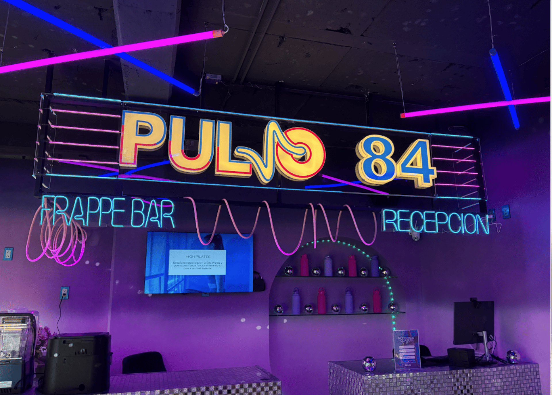 an abstract photo of a curved building with a blue sky in the background