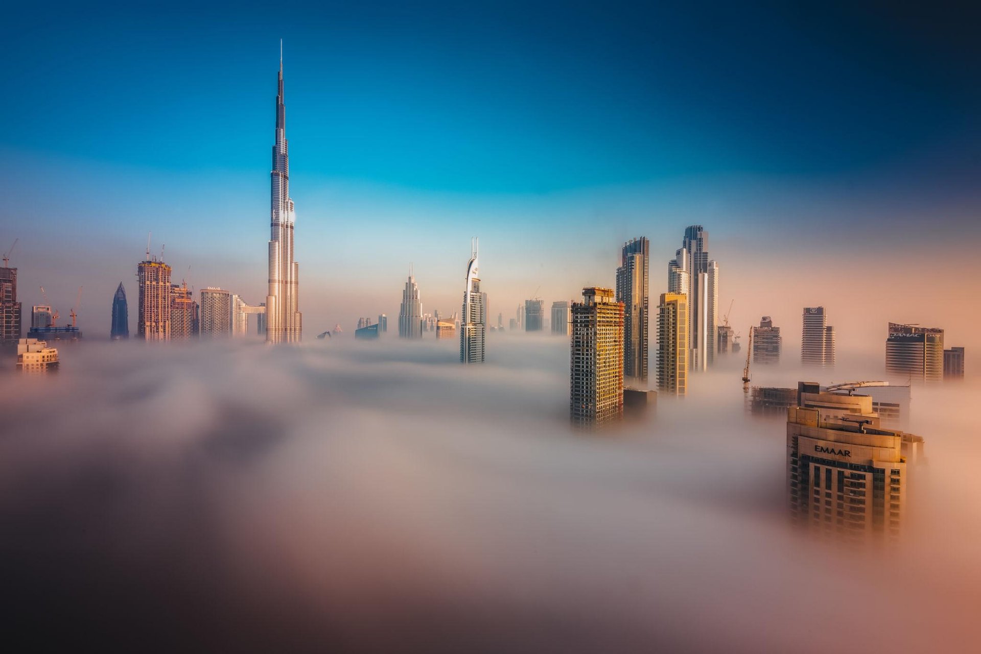 woman in black pants standing on window during daytime