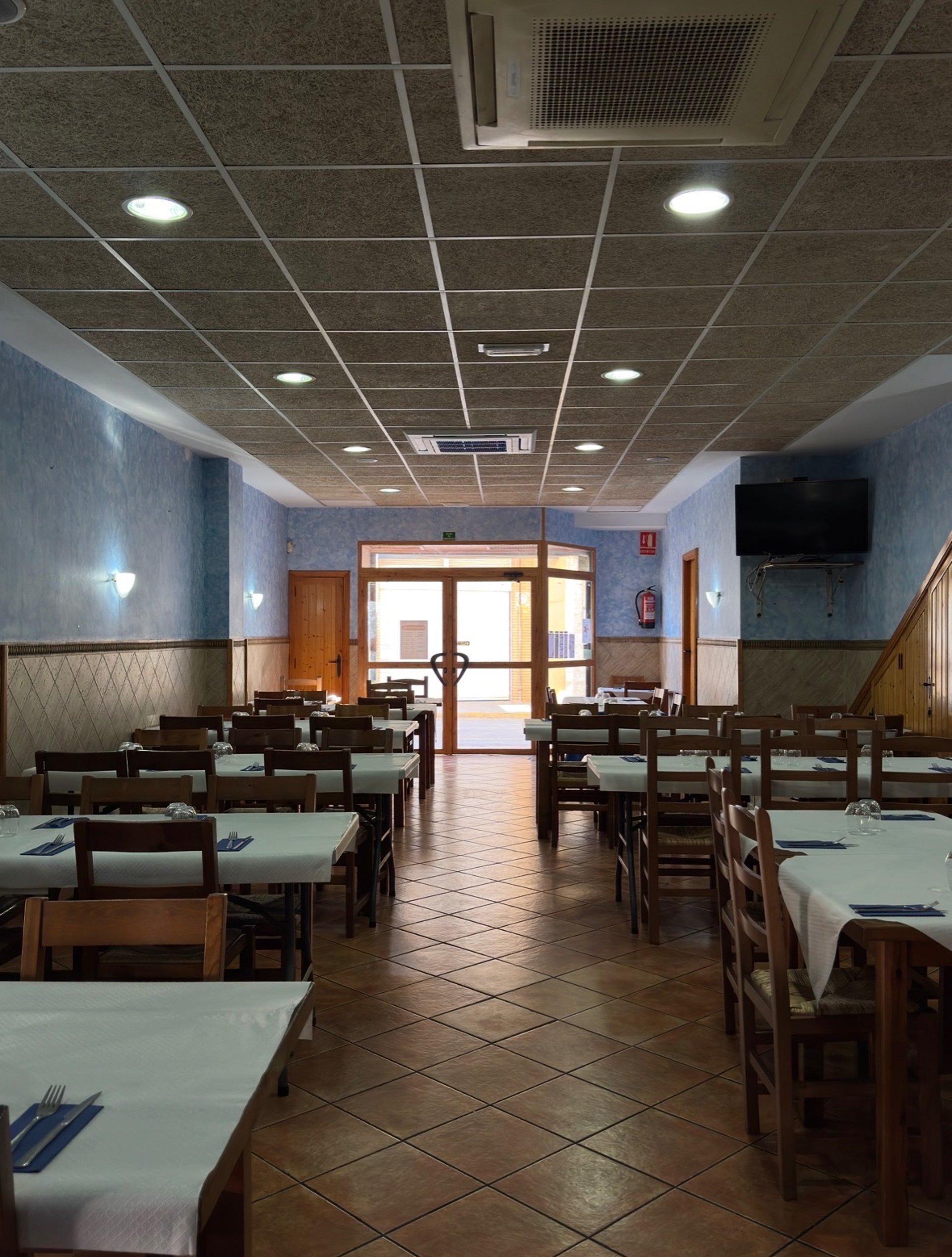 woman wearing yellow long-sleeved dress under white clouds and blue sky during daytime