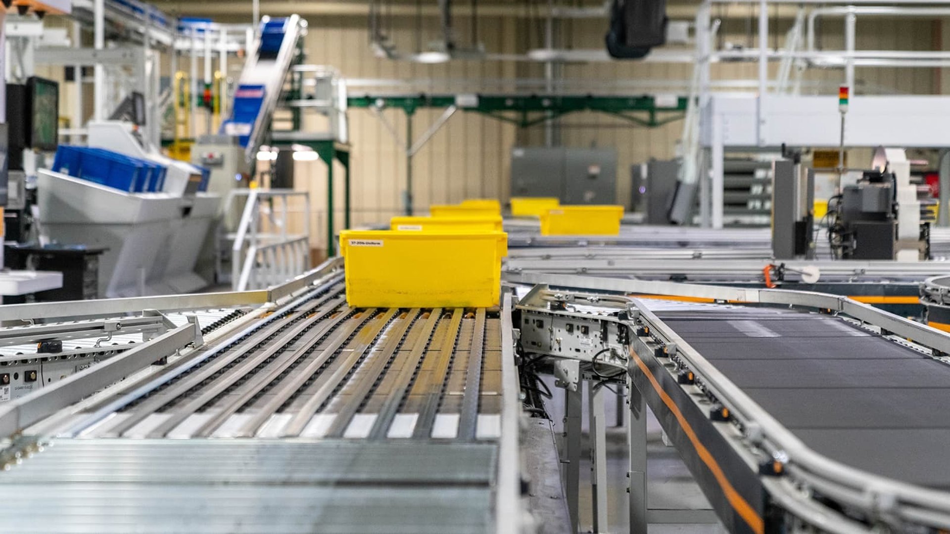 an abstract photo of a curved building with a blue sky in the background