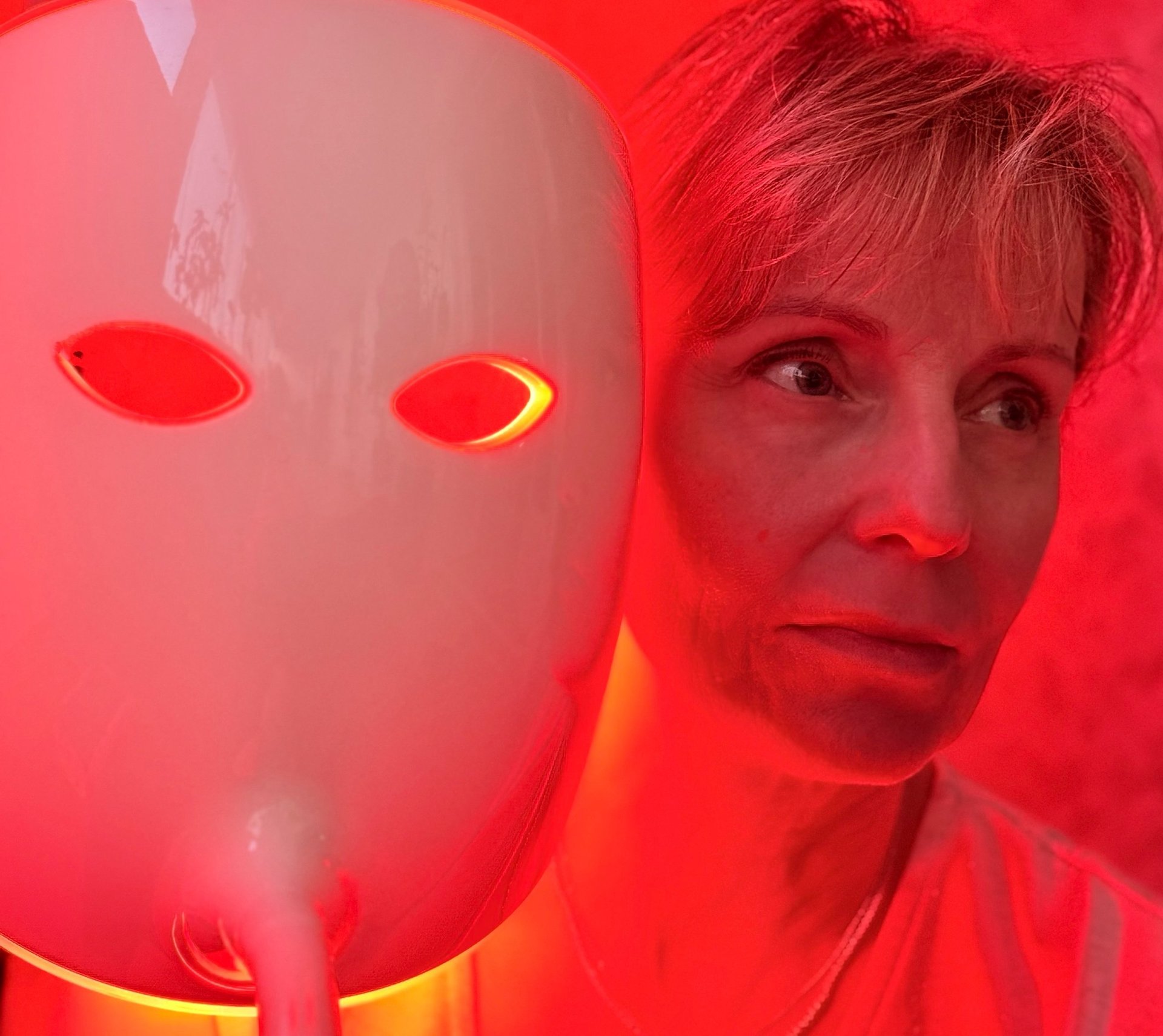 woman wearing yellow long-sleeved dress under white clouds and blue sky during daytime