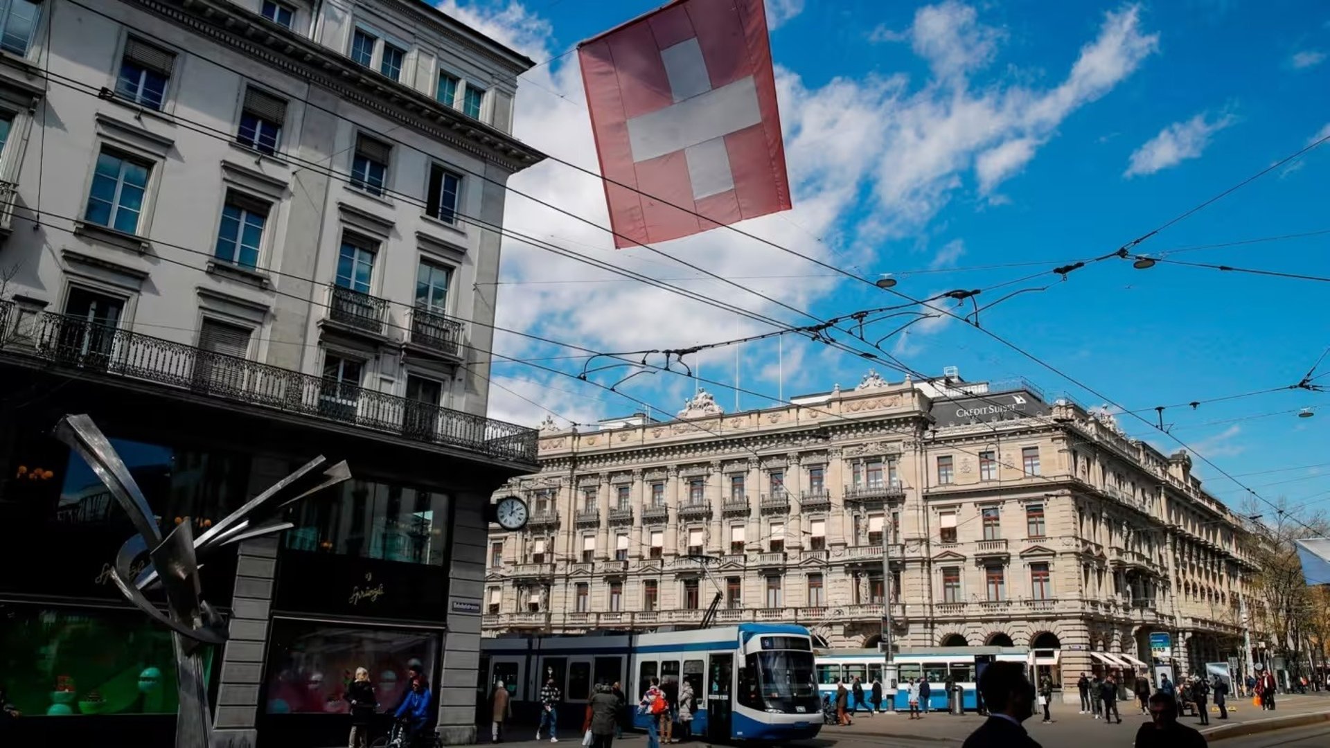 woman wearing yellow long-sleeved dress under white clouds and blue sky during daytime