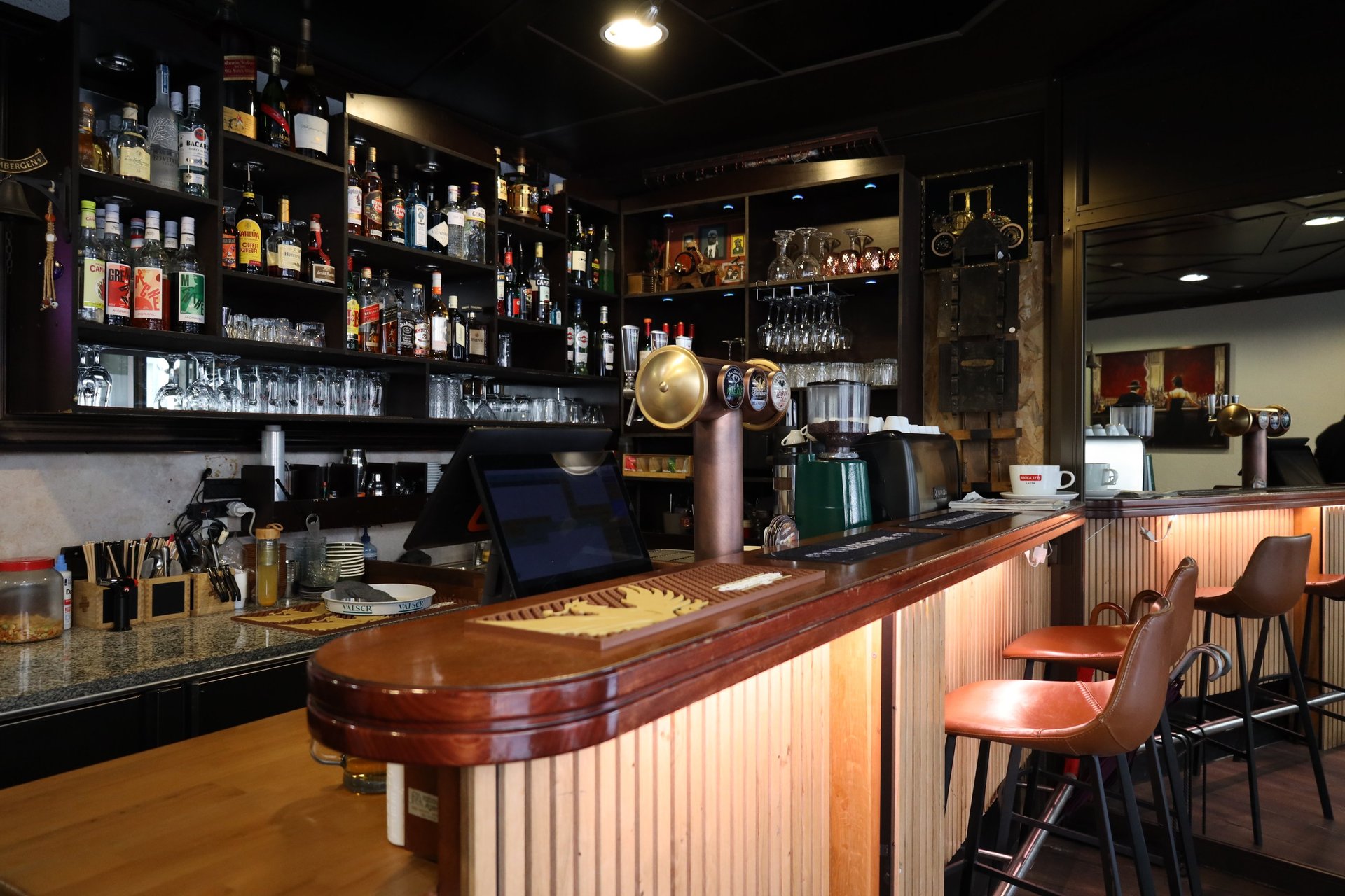 an abstract photo of a curved building with a blue sky in the background