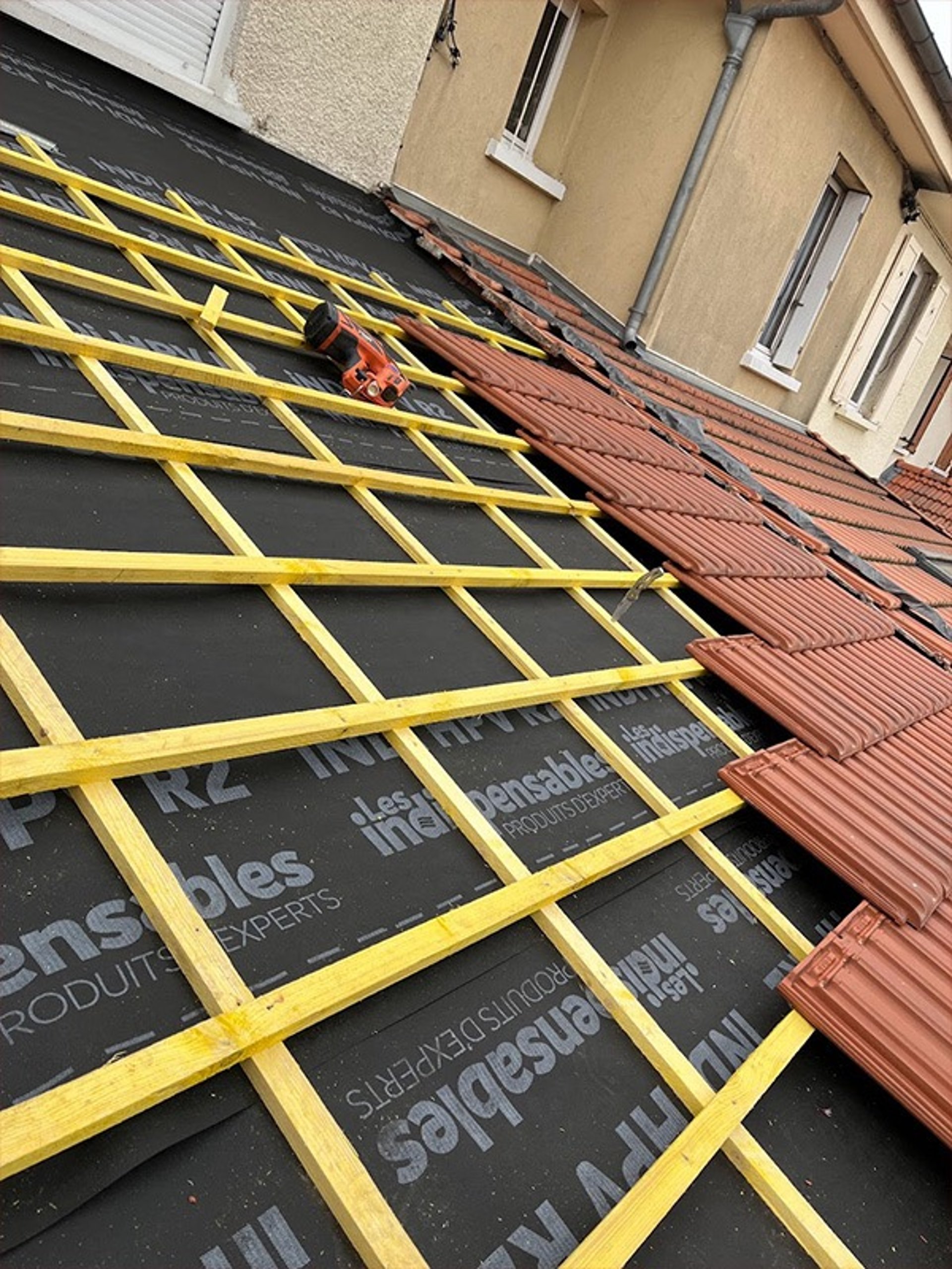 an abstract photo of a curved building with a blue sky in the background