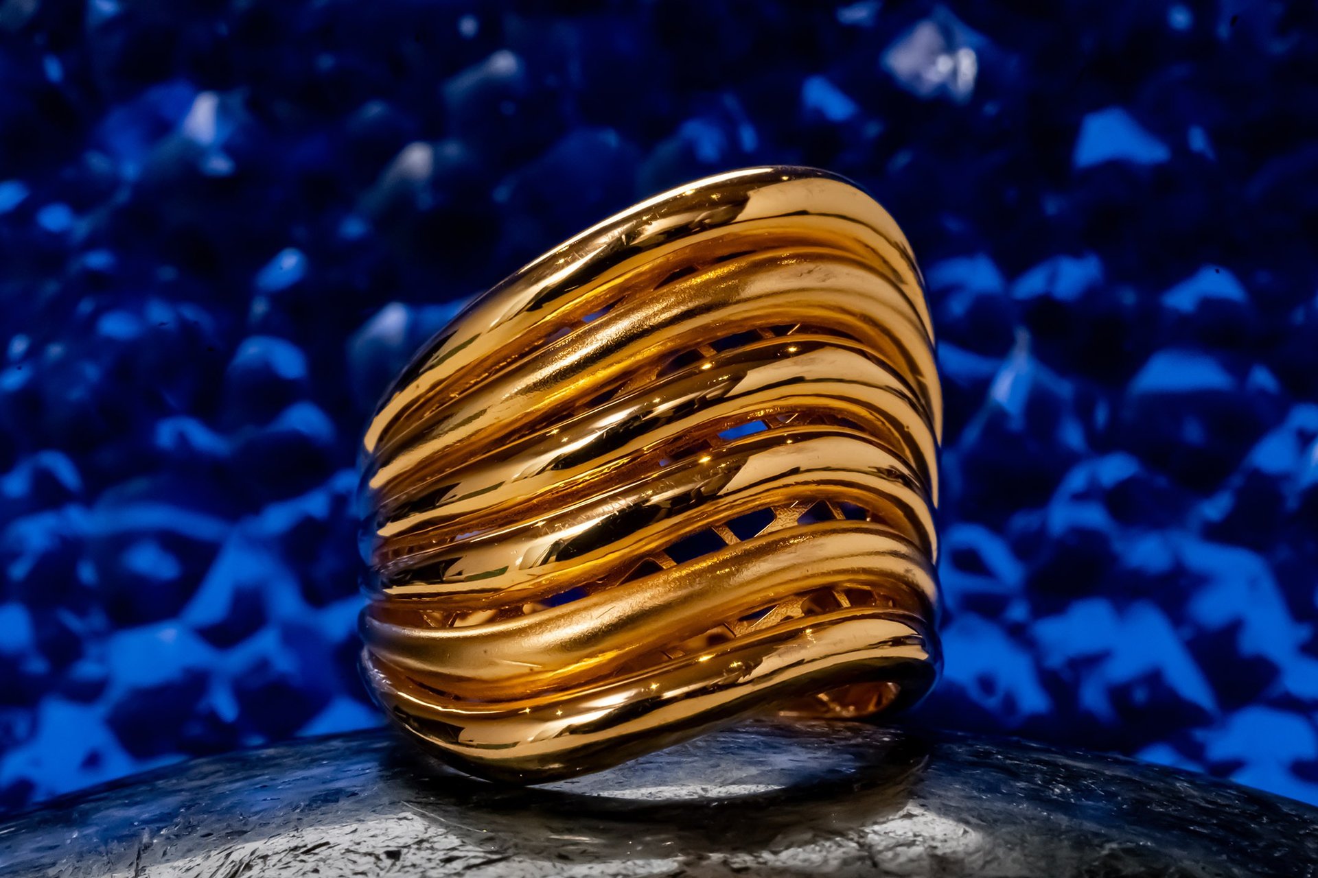 an abstract photo of a curved building with a blue sky in the background