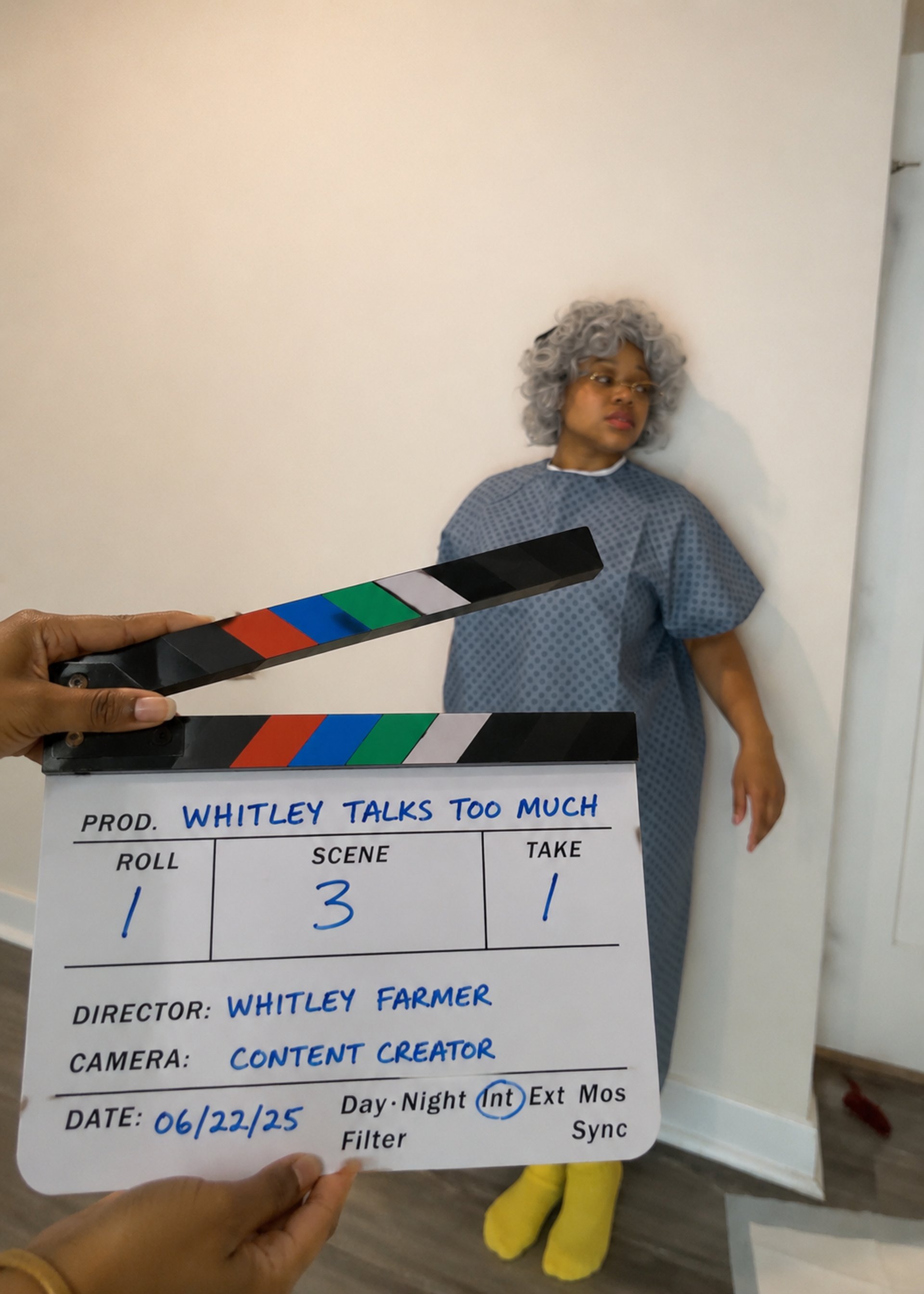 Behind-the-scenes content creation showing a nursing comedy character and film clapperboard during video production.