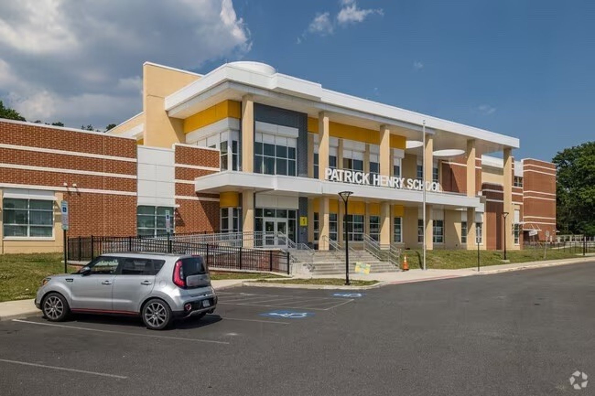 an abstract photo of a curved building with a blue sky in the background