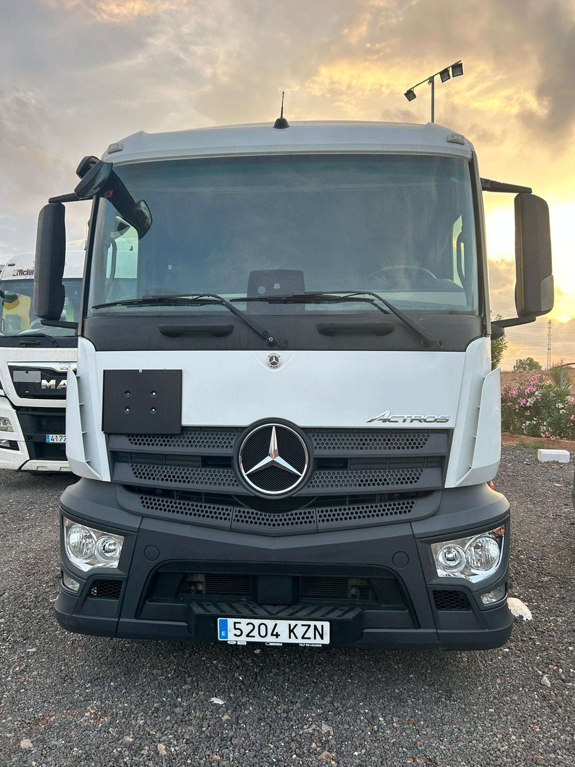 woman wearing yellow long-sleeved dress under white clouds and blue sky during daytime