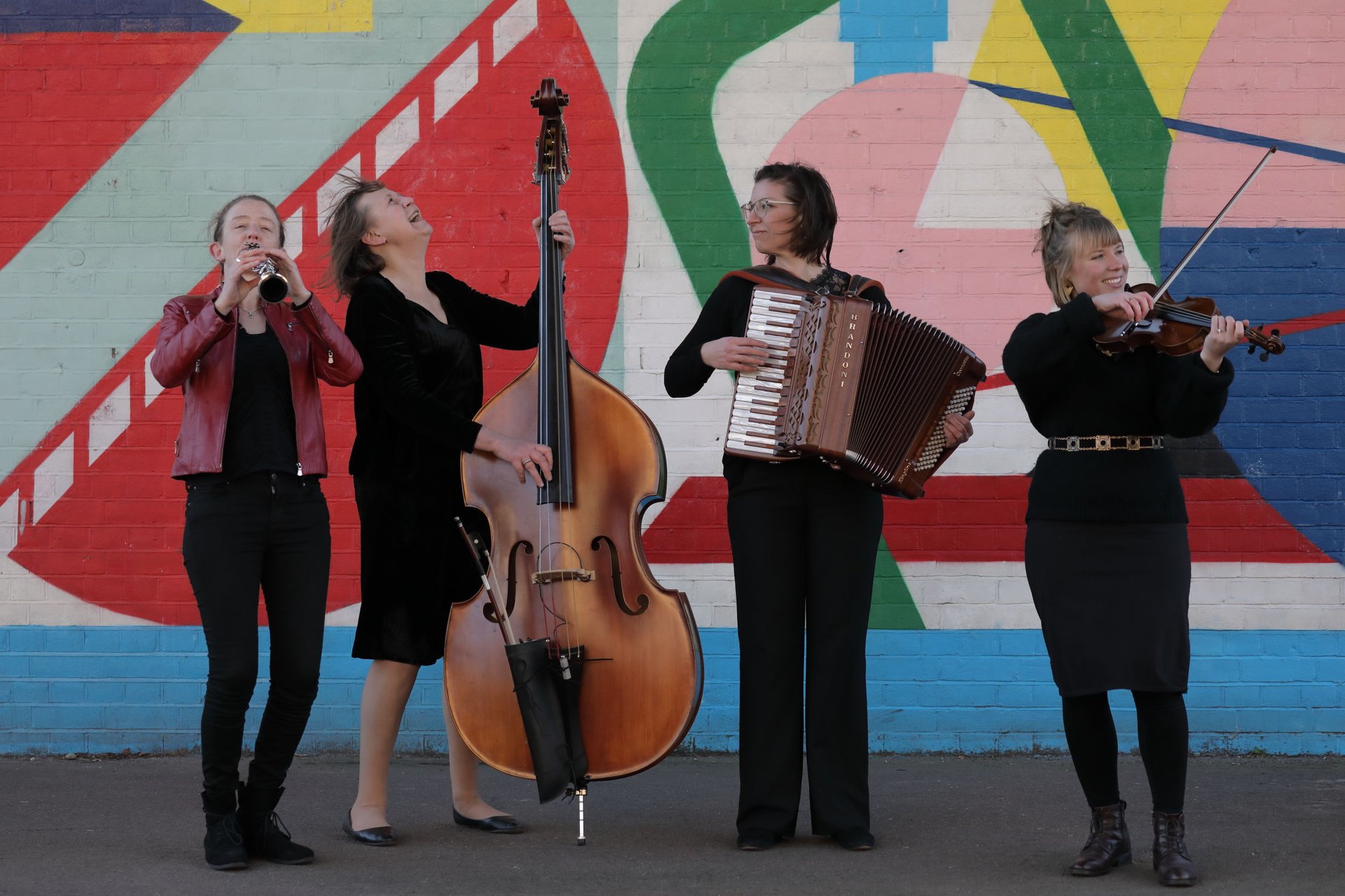 an abstract photo of a curved building with a blue sky in the background