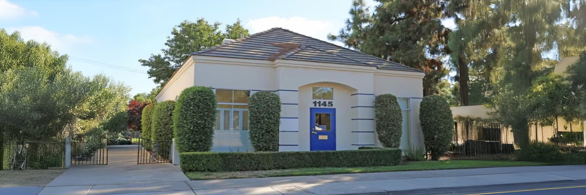 woman wearing yellow long-sleeved dress under white clouds and blue sky during daytime