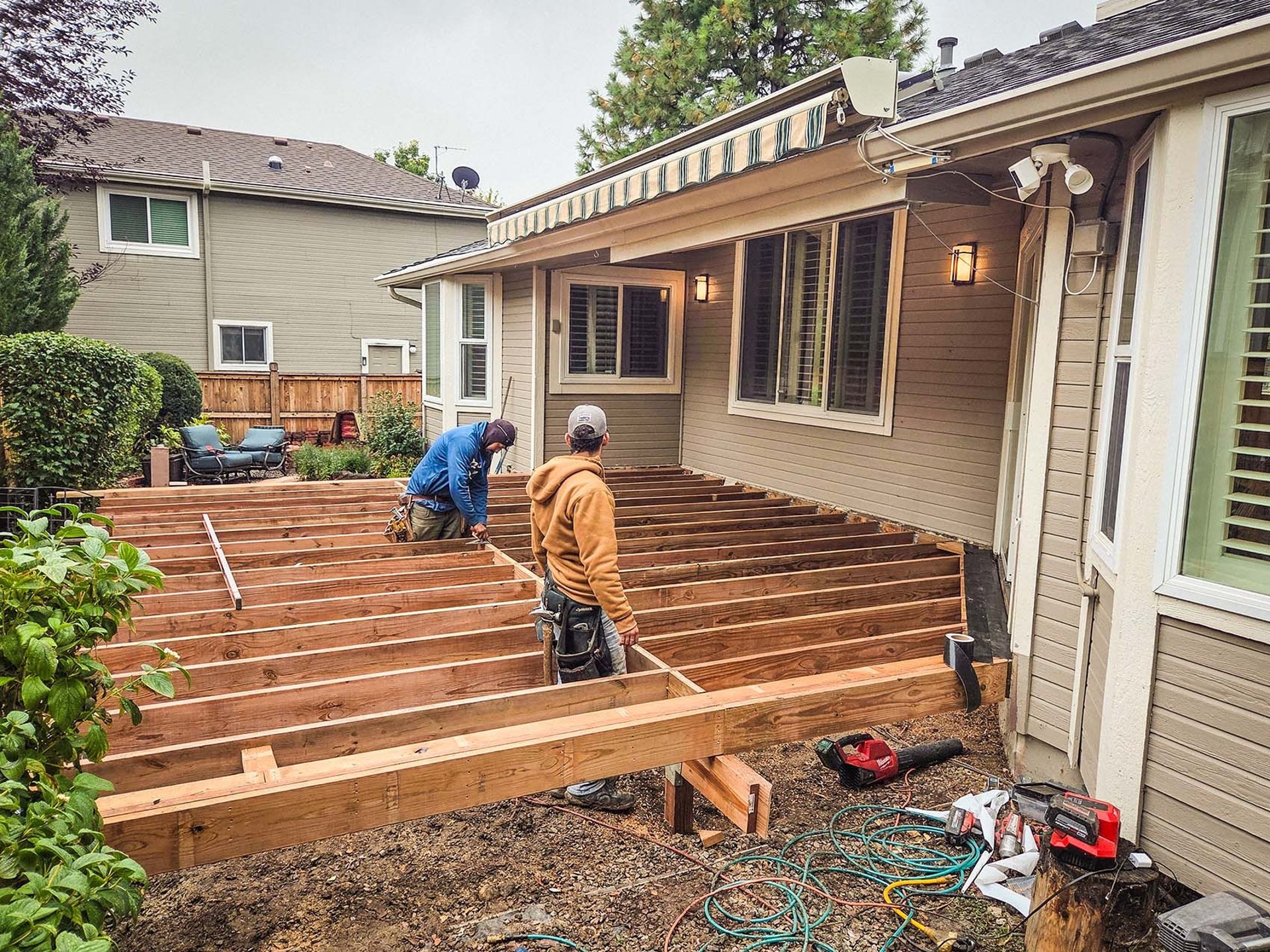Custom deck framing project behind a home in Lakewood CO