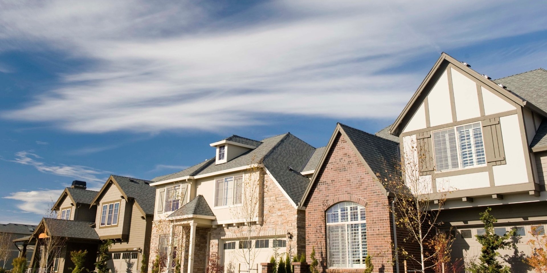 city with high rise buildings near mountain during sunset