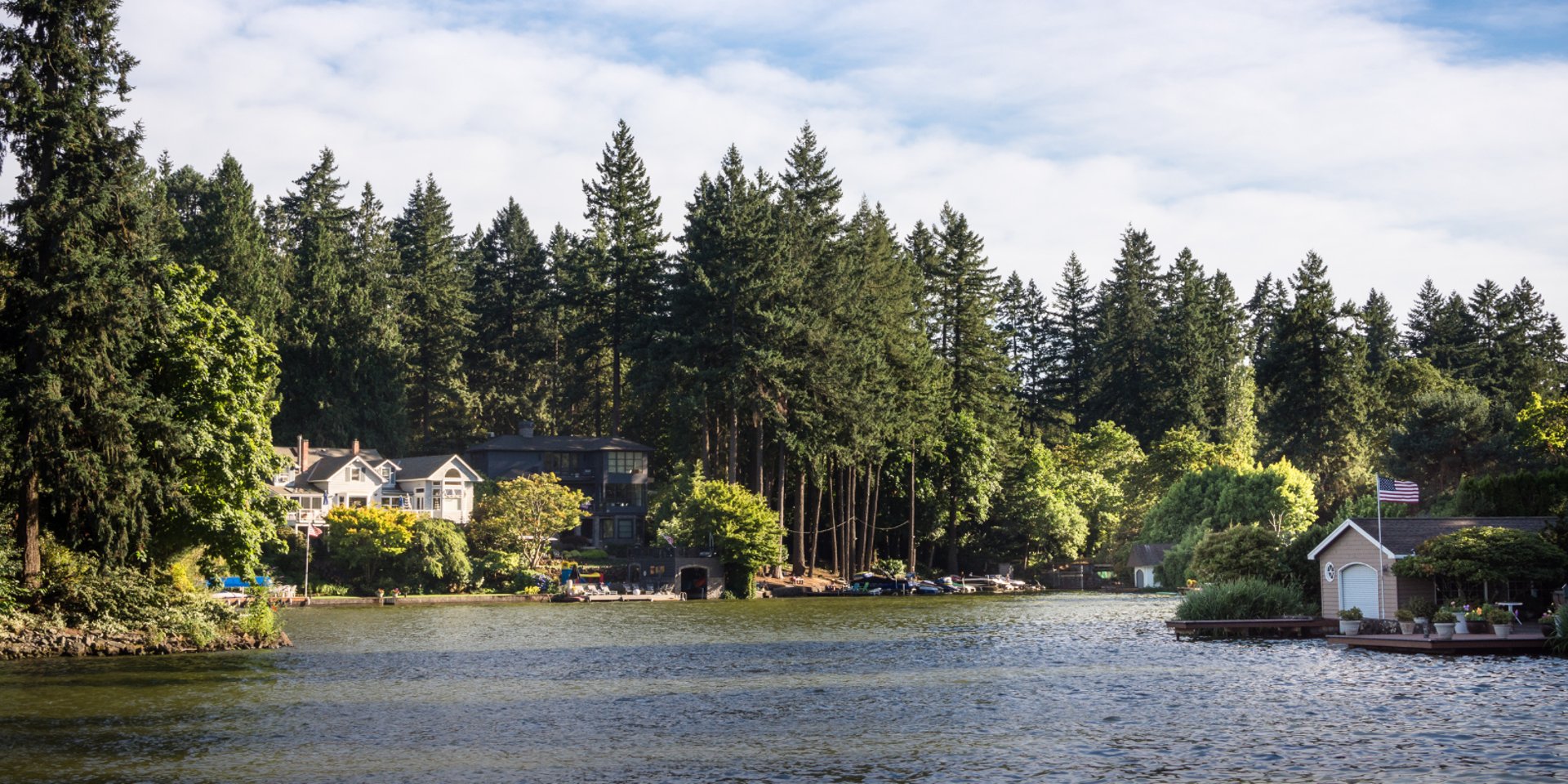 city with high rise buildings near mountain during sunset