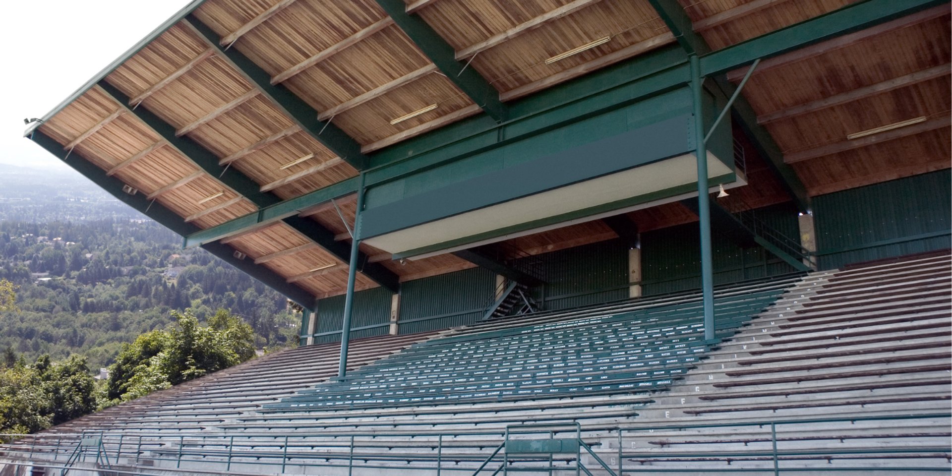 city with high rise buildings near mountain during sunset