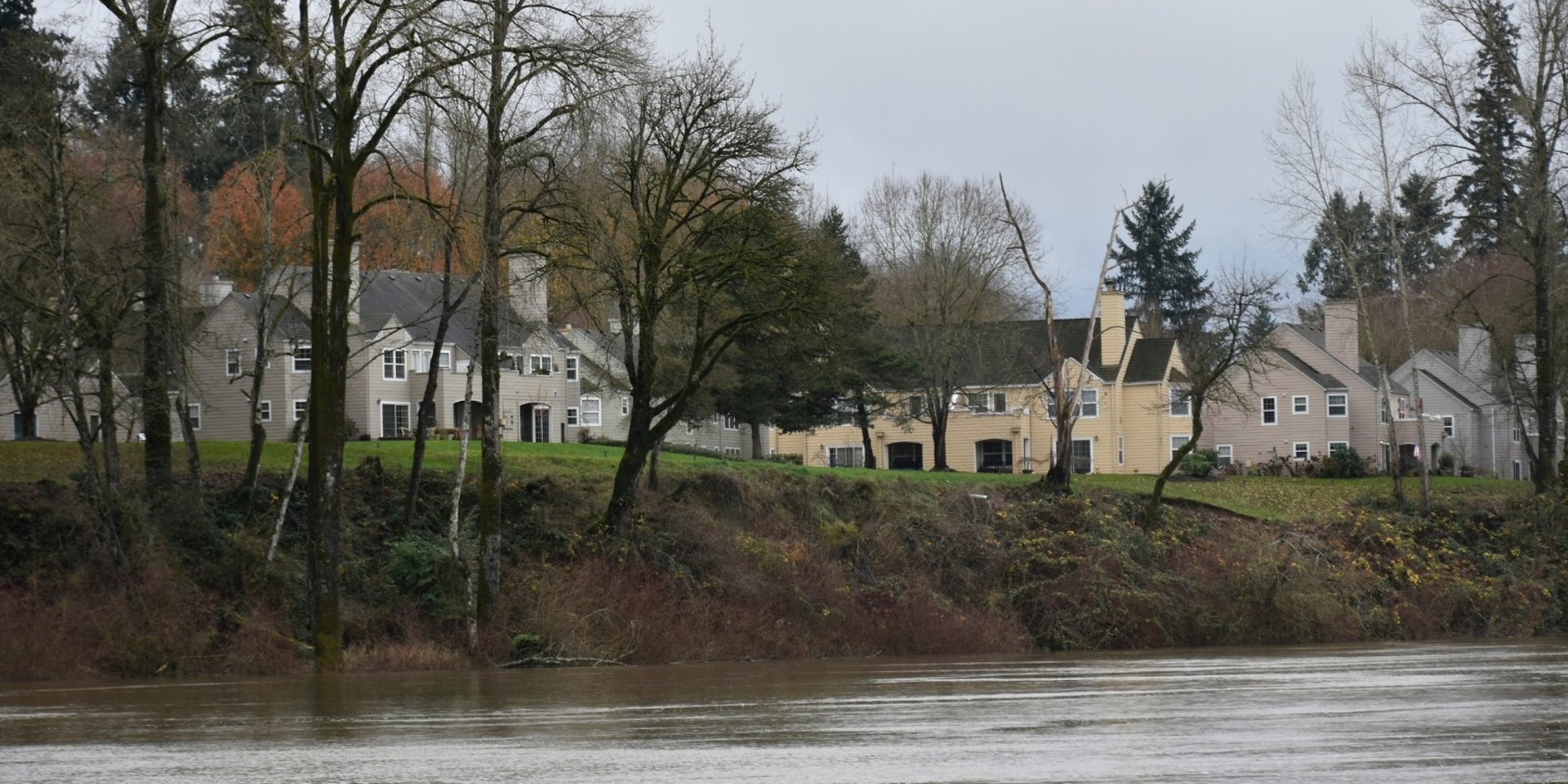 city with high rise buildings near mountain during sunset