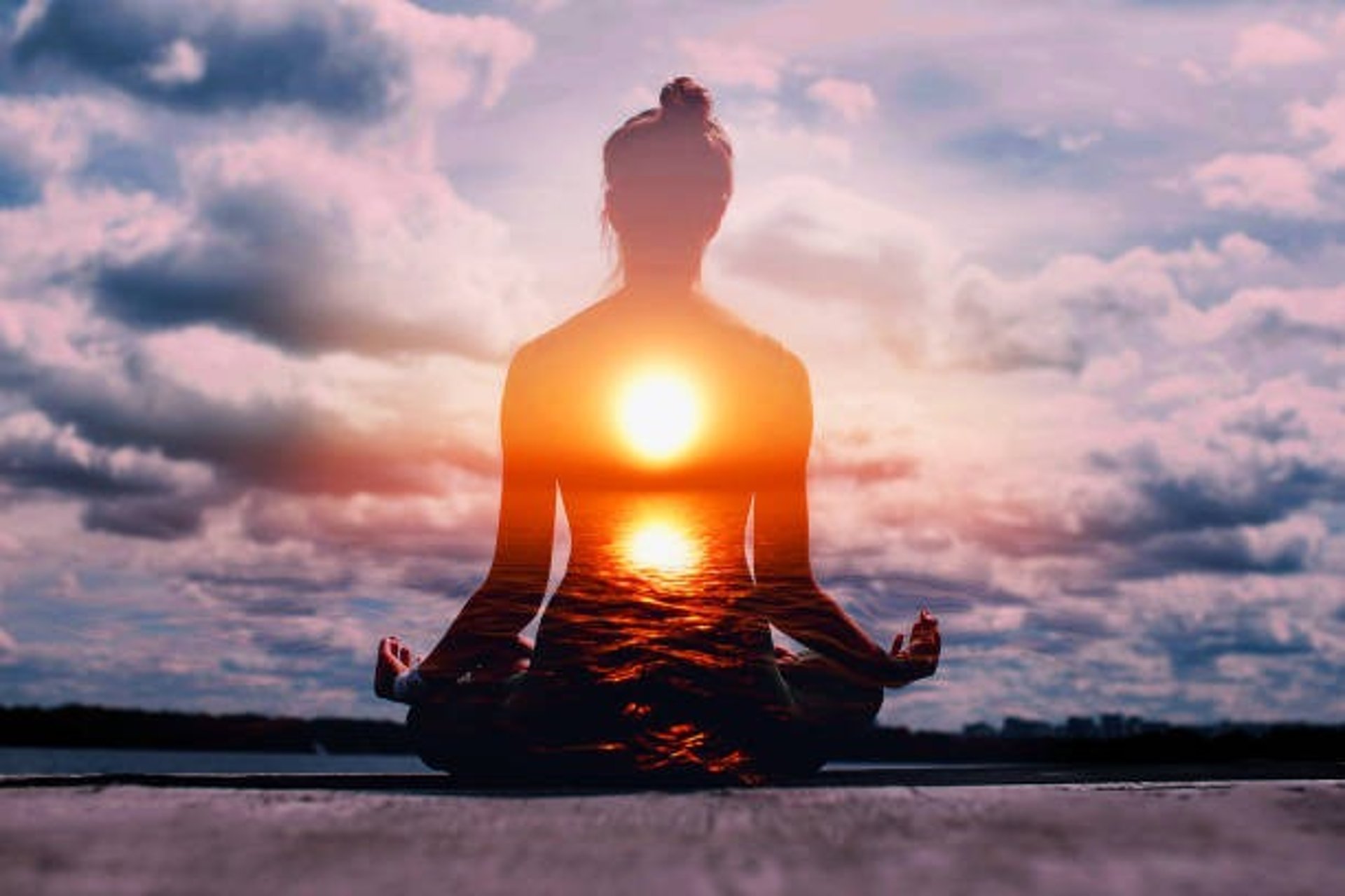silhouette of woman doing yoga