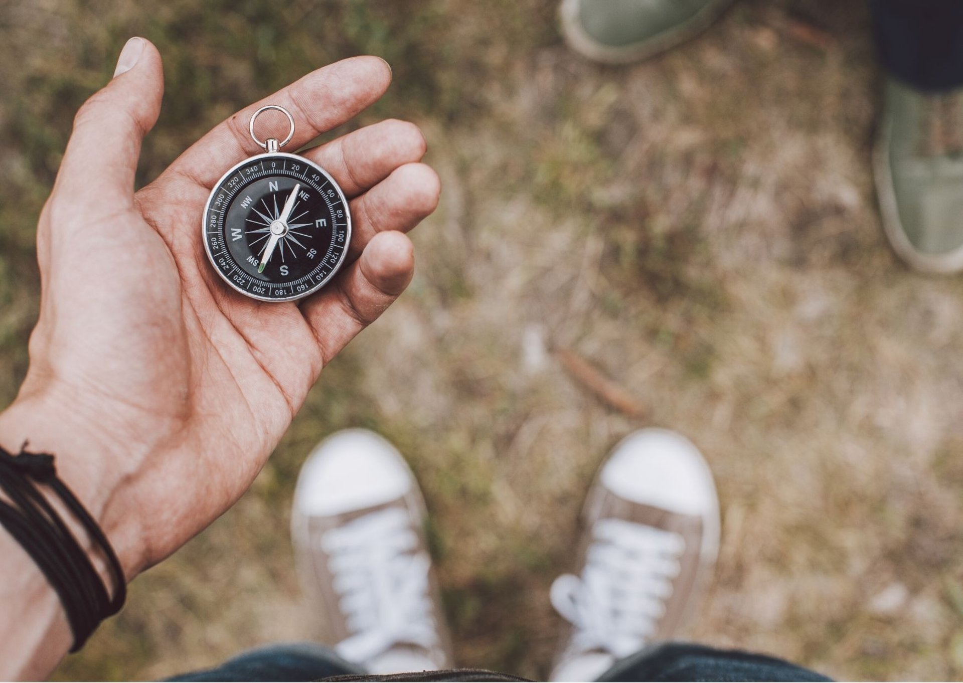 a woman sitting in a field of grass