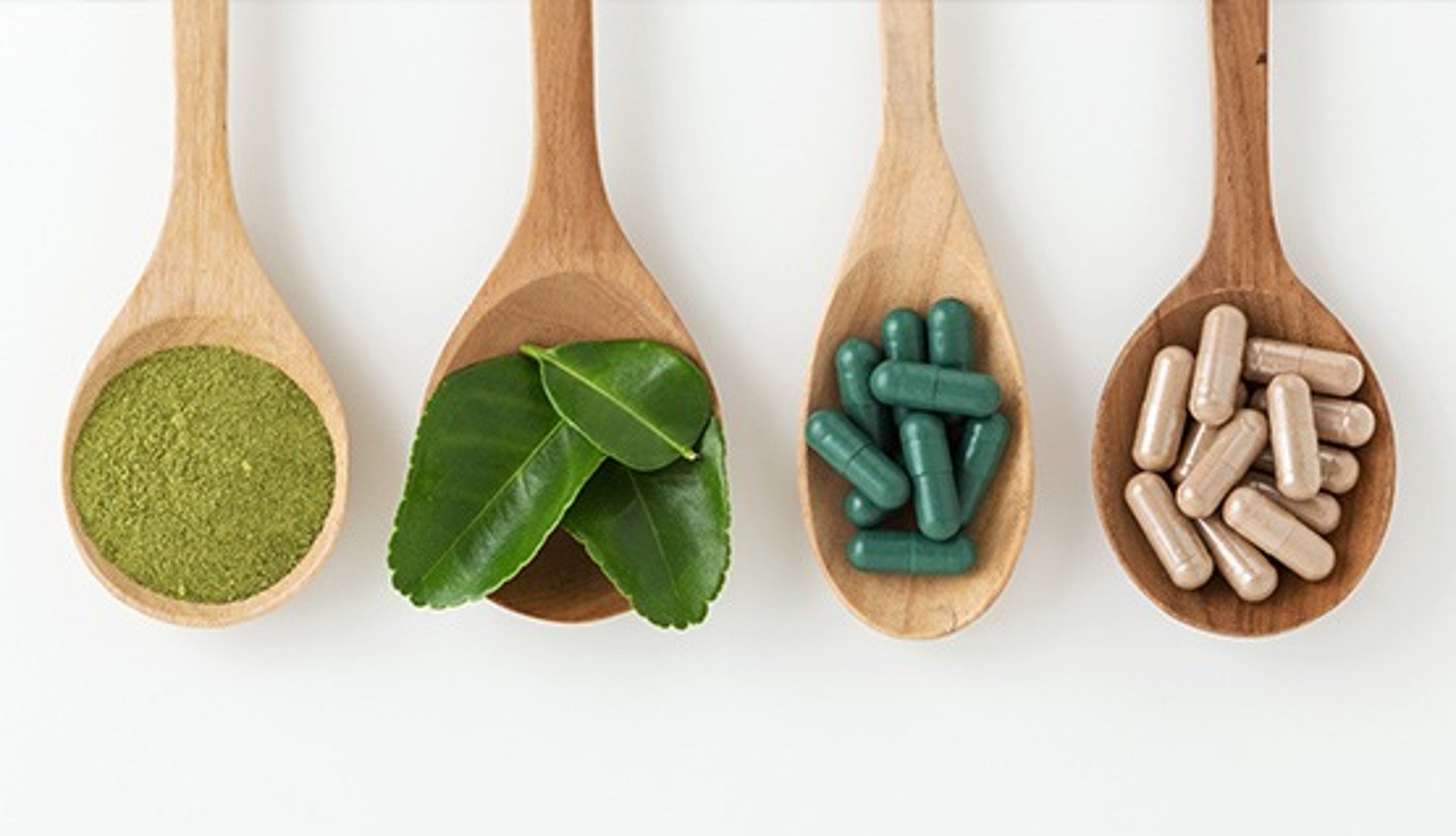 gray concrete road top between green trees