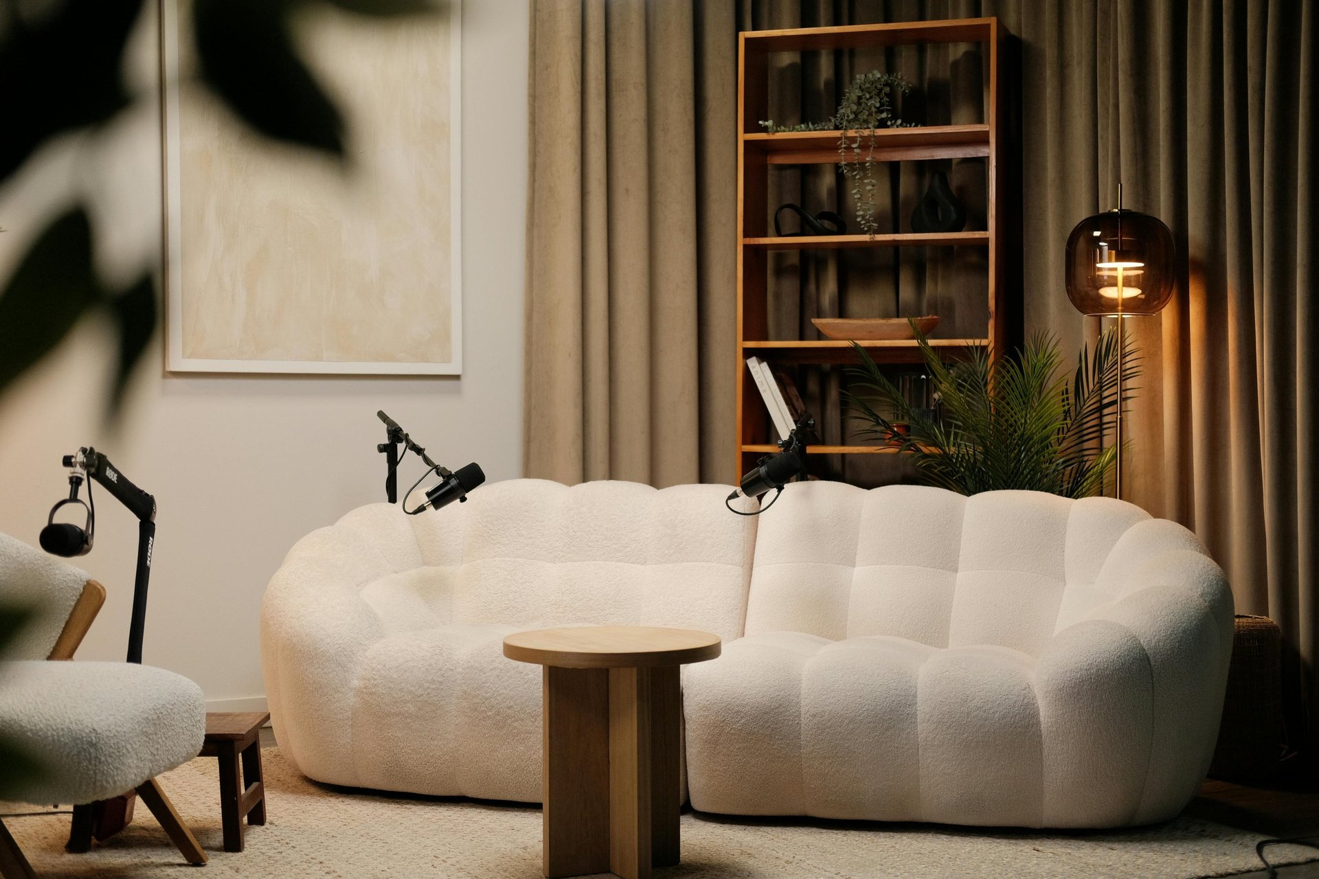 a room with a couch and a microphone in it