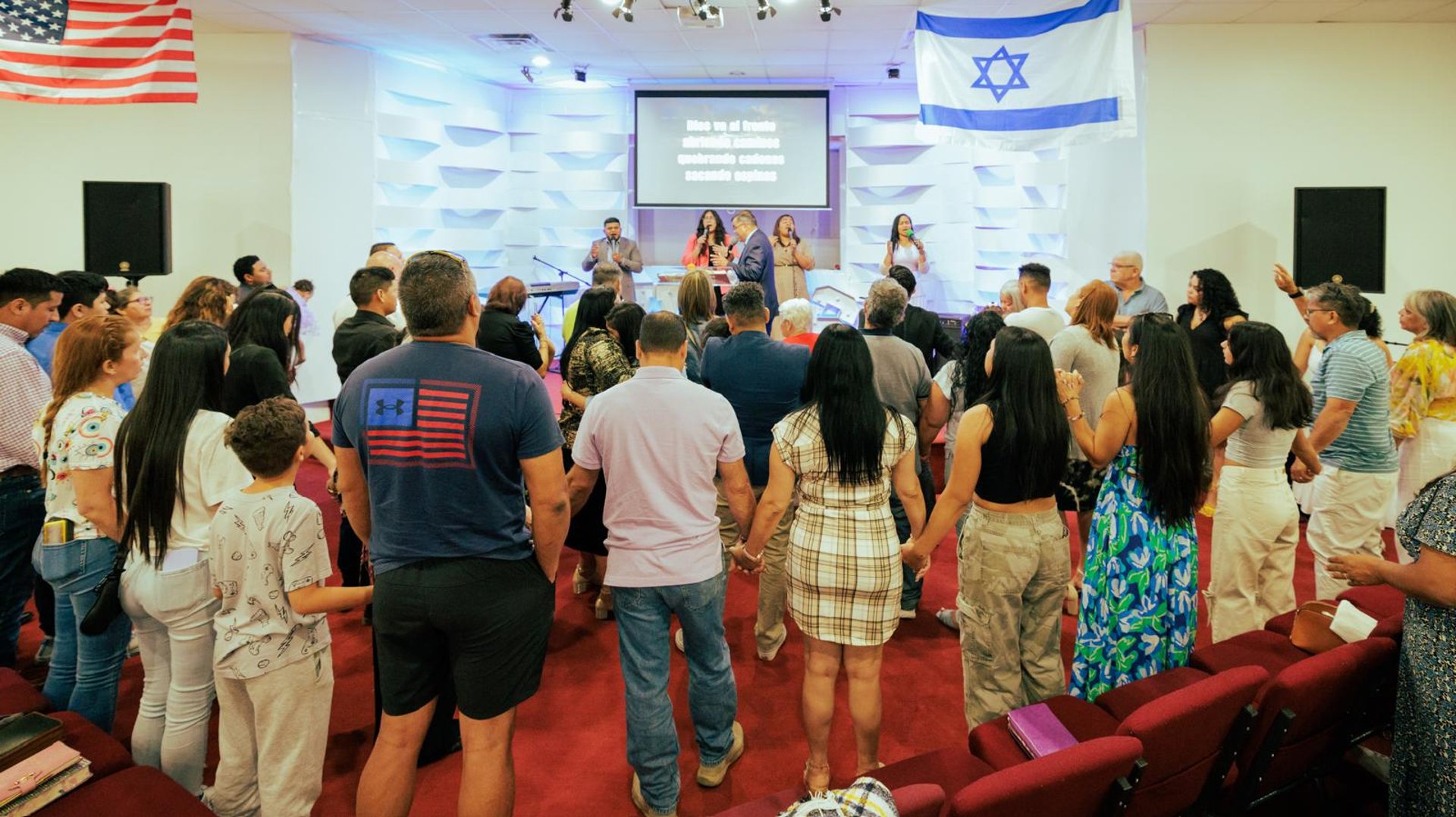 an abstract photo of a curved building with a blue sky in the background