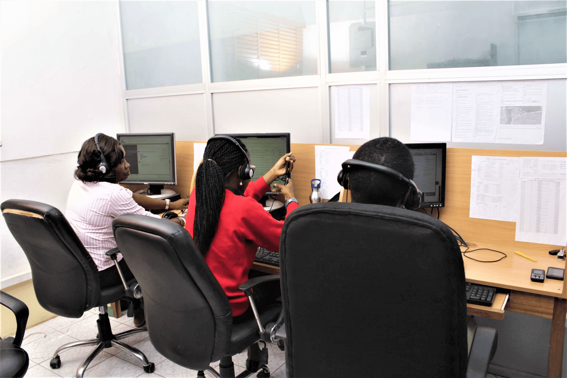 A man sanding a wooden table with a sander