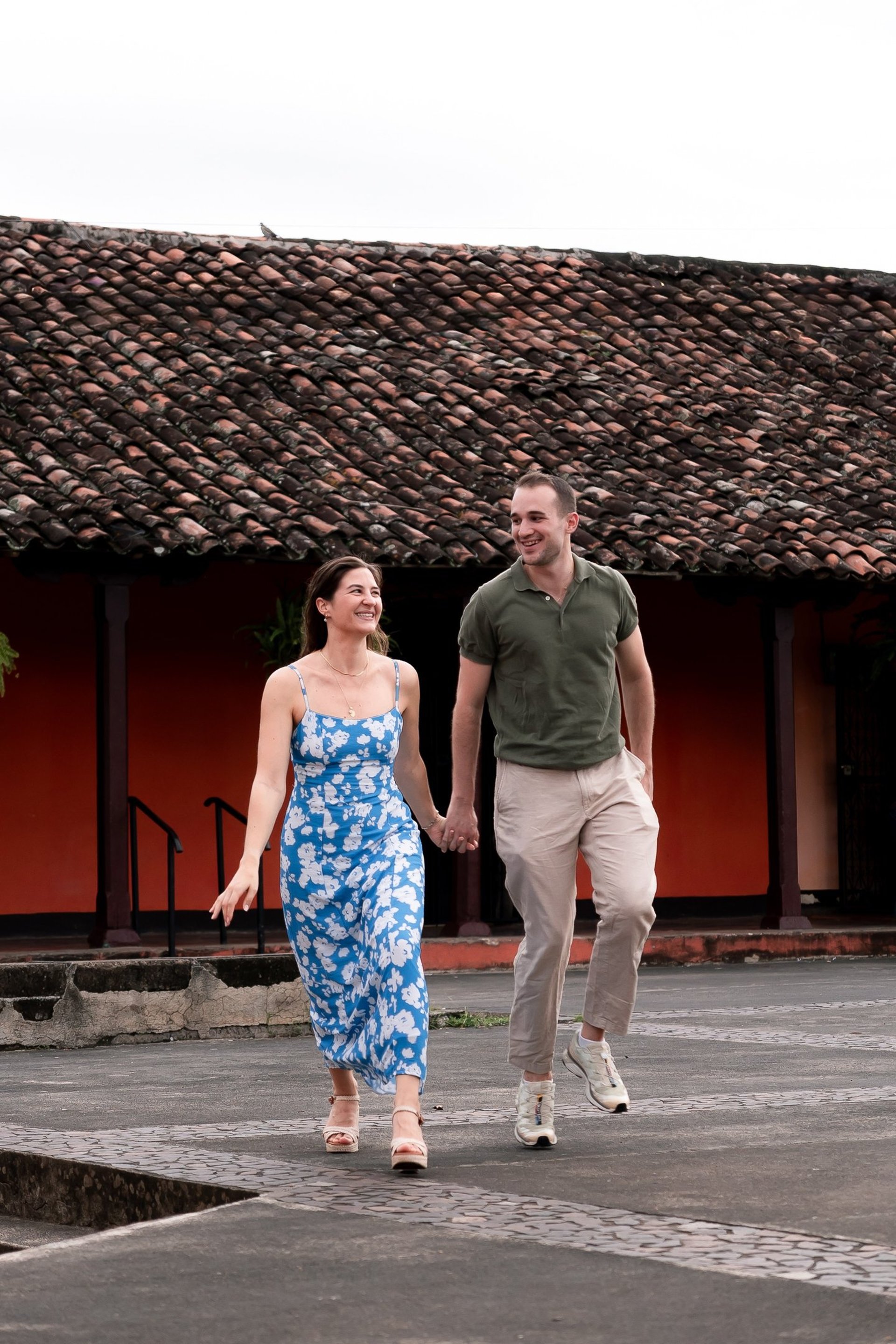an abstract photo of a curved building with a blue sky in the background