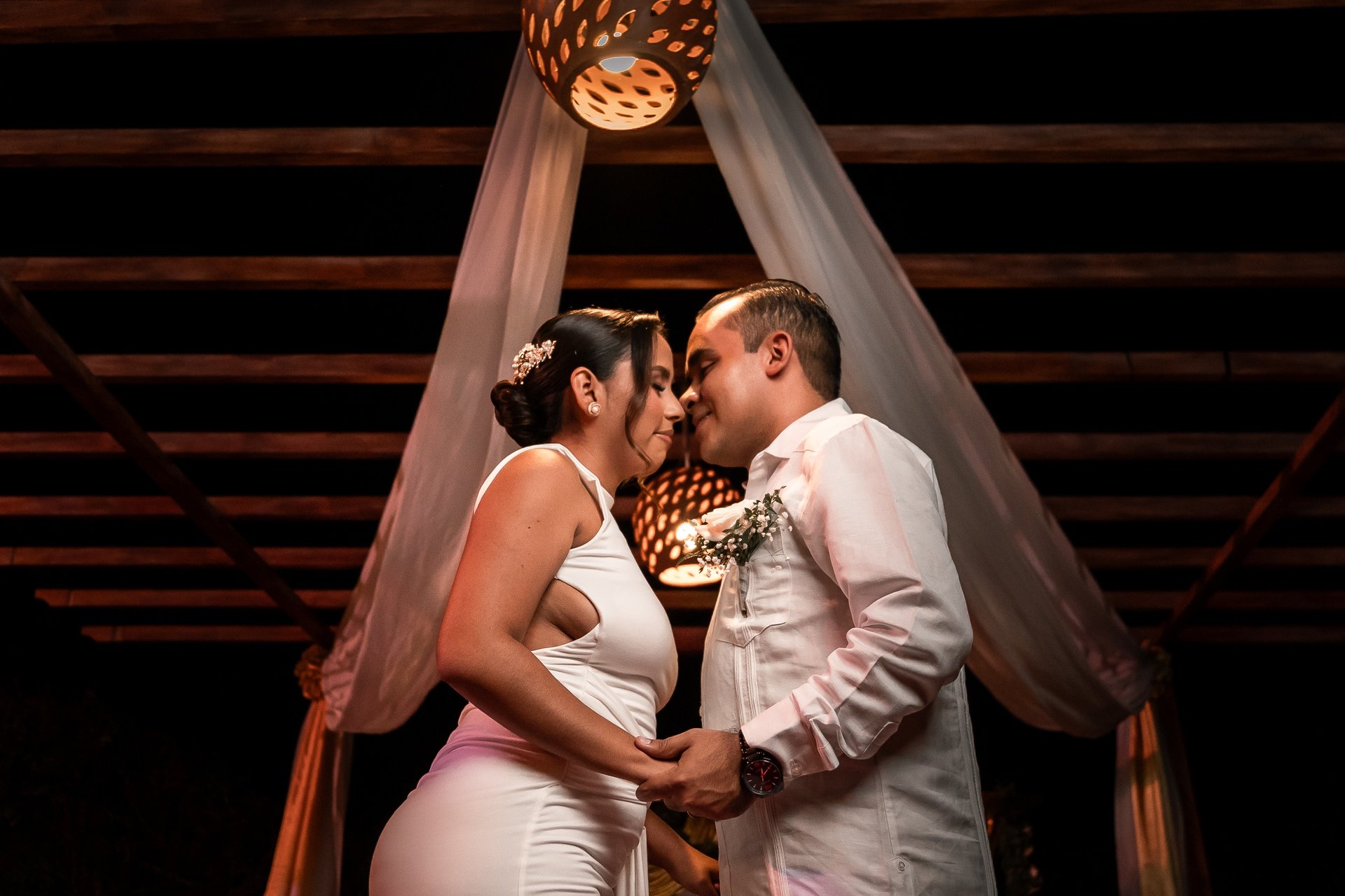 an abstract photo of a curved building with a blue sky in the background
