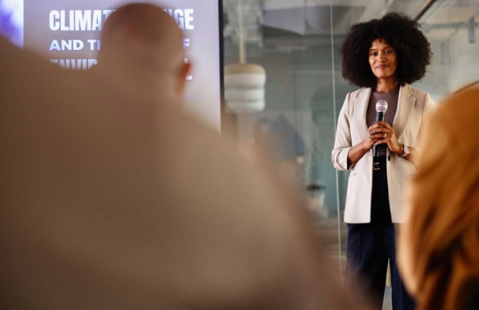 People painting at a table in an art class.