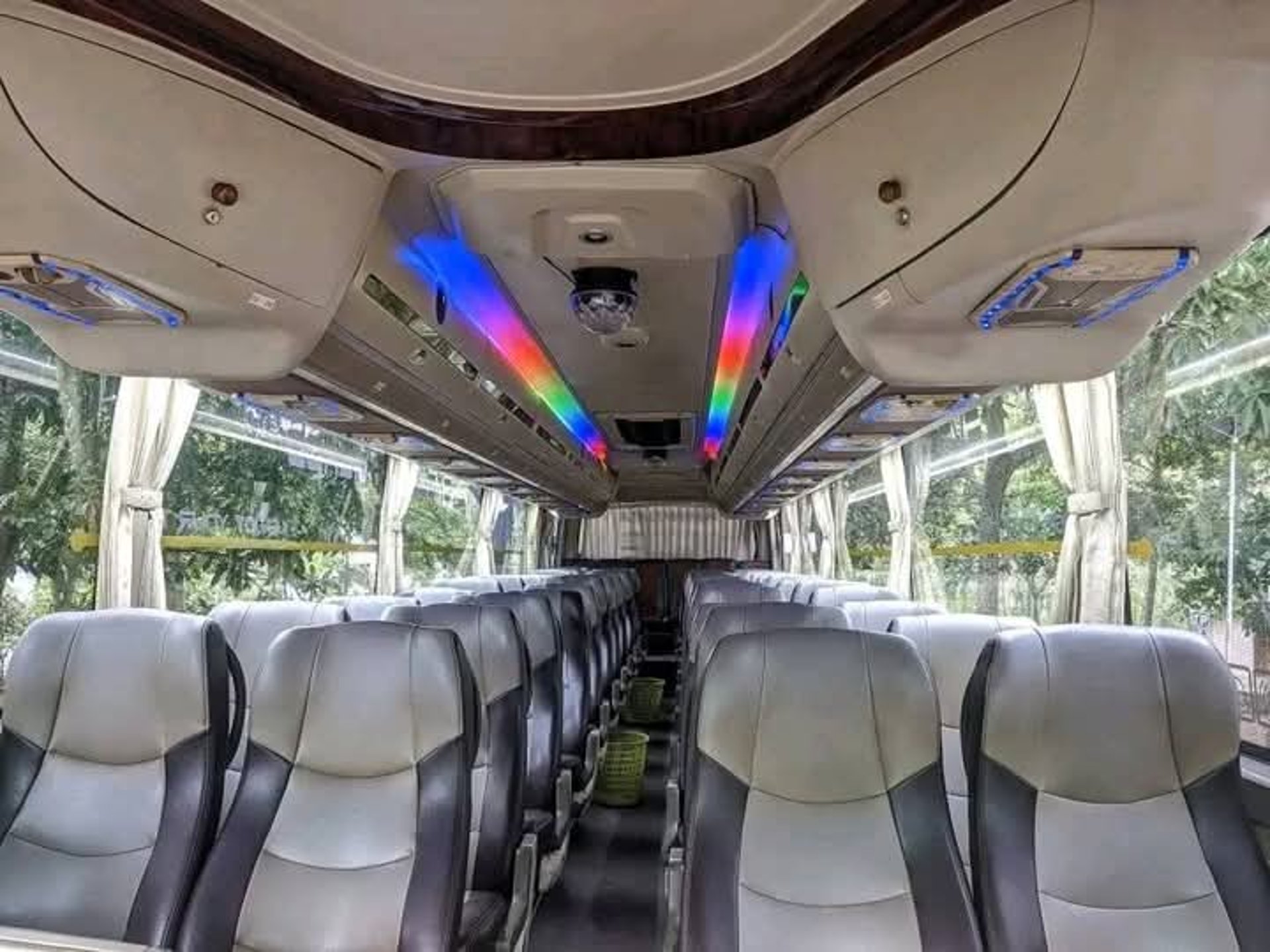 woman wearing yellow long-sleeved dress under white clouds and blue sky during daytime