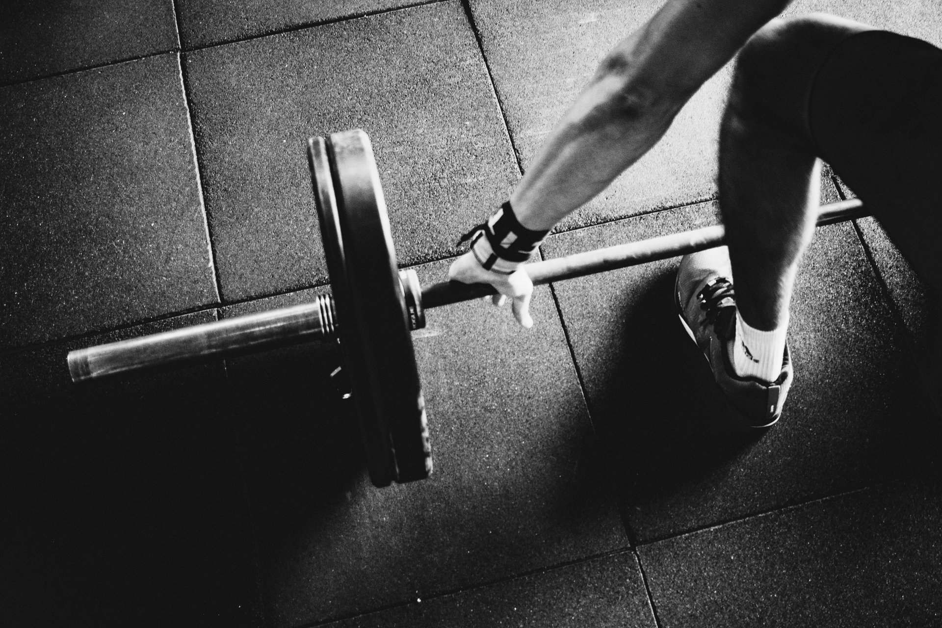 an abstract photo of a curved building with a blue sky in the background